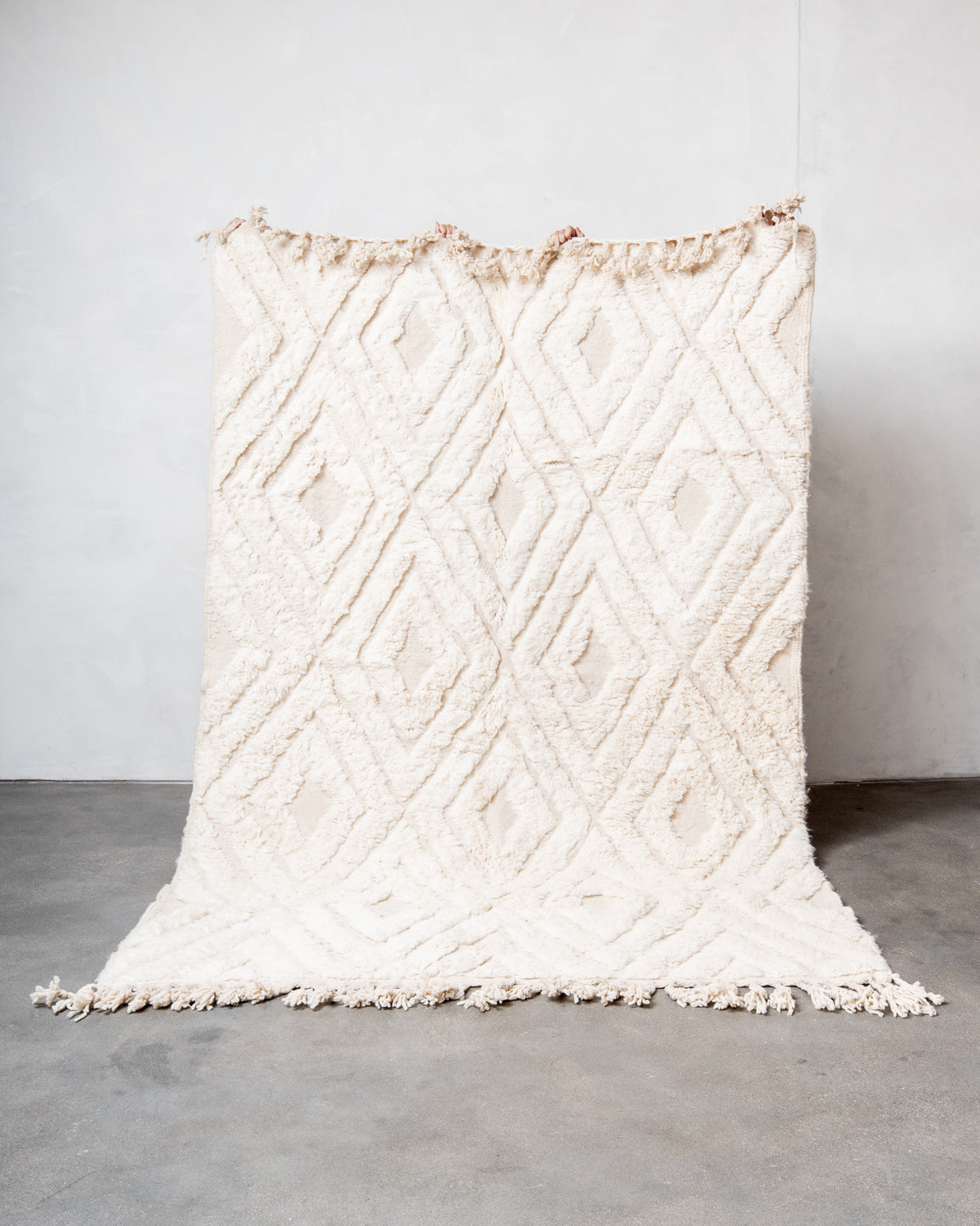 Modern, designer, handcrafted Berber rug from Morocco. Beniourain carpet with beautiful colours and patterns and fluffy wool texture.