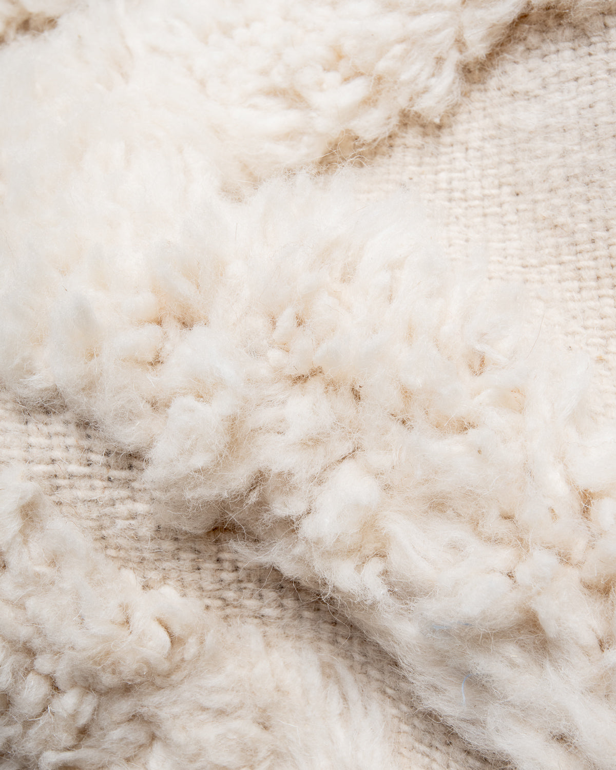 Modern, designer, handcrafted Berber rug from Morocco. Beniourain carpet with beautiful colours and patterns and fluffy wool texture.