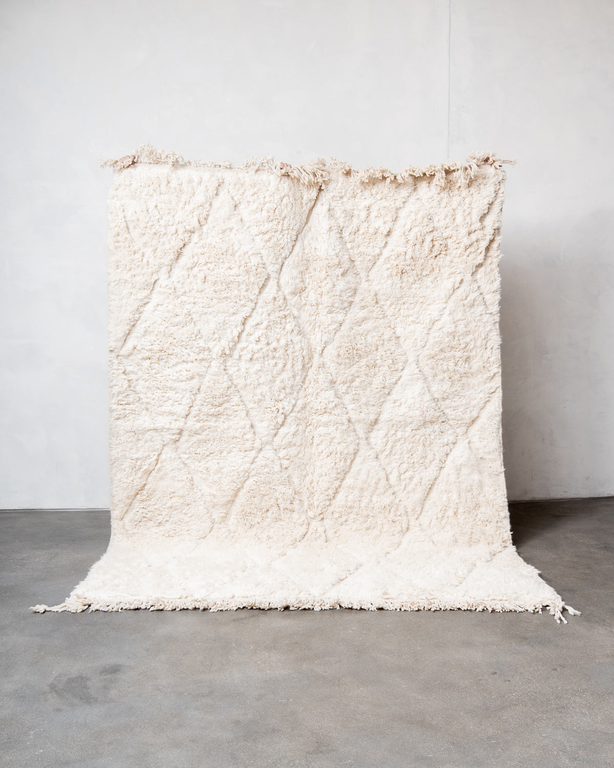 Modern, designer, handcrafted Berber rug from Morocco. Beniourain carpet with beautiful colours and patterns and fluffy wool texture.