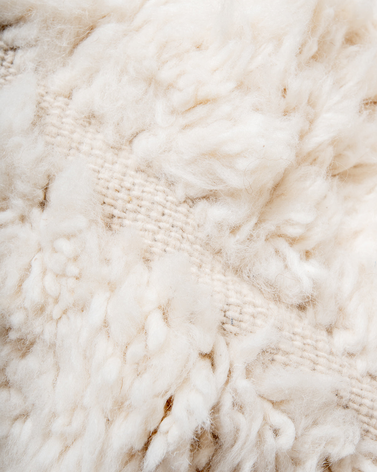 Modern, designer, handcrafted Berber rug from Morocco. Beniourain carpet with beautiful colours and patterns and fluffy wool texture.