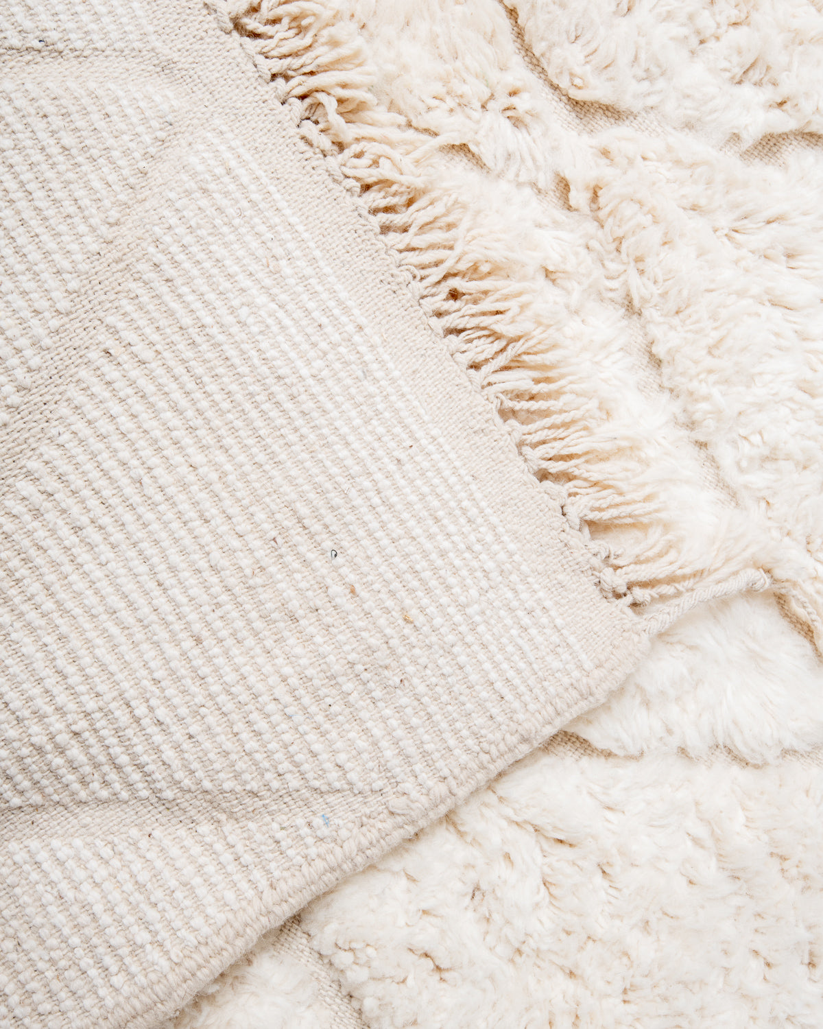 Modern, designer, handcrafted Berber rug from Morocco. Beniourain carpet with beautiful colours and patterns and fluffy wool texture.