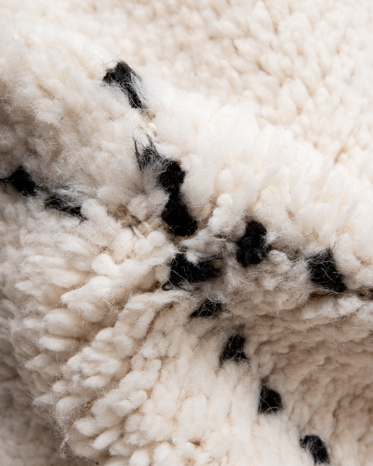 Modern, designer, handcrafted Berber rug from Morocco. Beniourain carpet with minimalist design, natural wool pile and a fluffy texture.