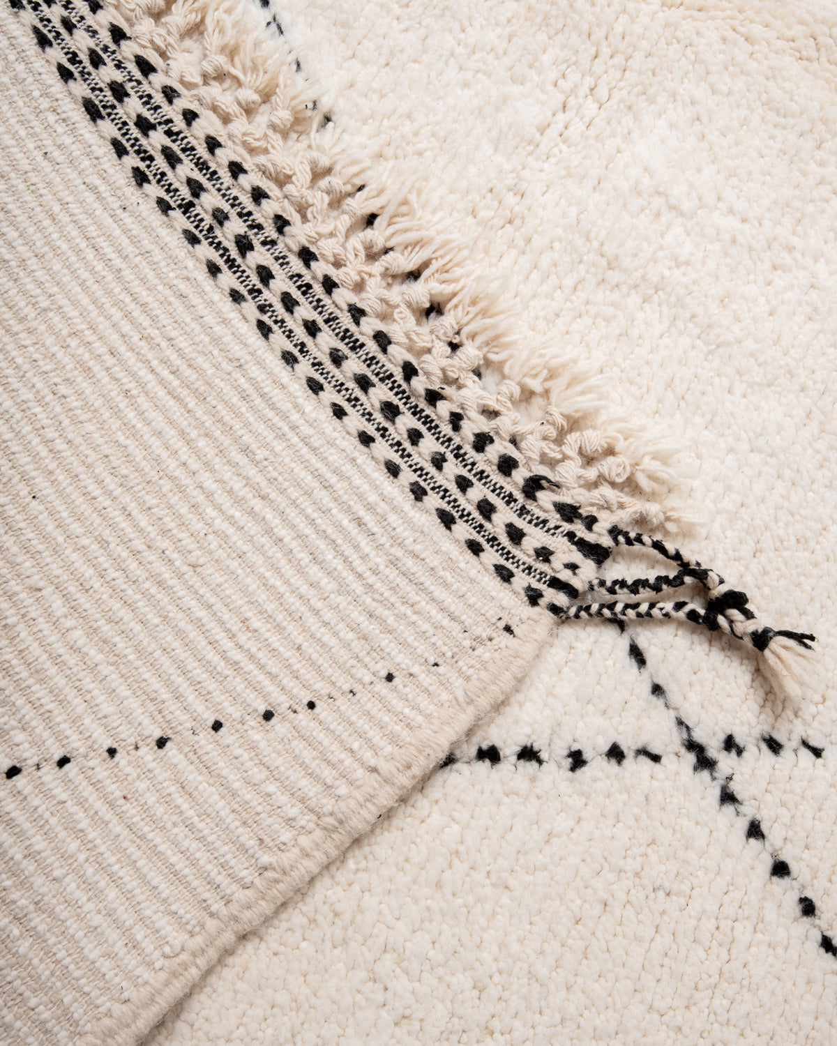 Modern, designer, handcrafted Berber rug from Morocco. Beniourain carpet with minimalist design, natural wool pile and a fluffy texture.