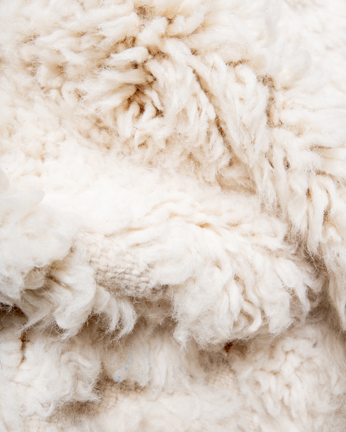 Modern, designer, handcrafted Berber rug from Morocco. Beniourain carpet with minimalist design, natural wool pile and a fluffy texture.