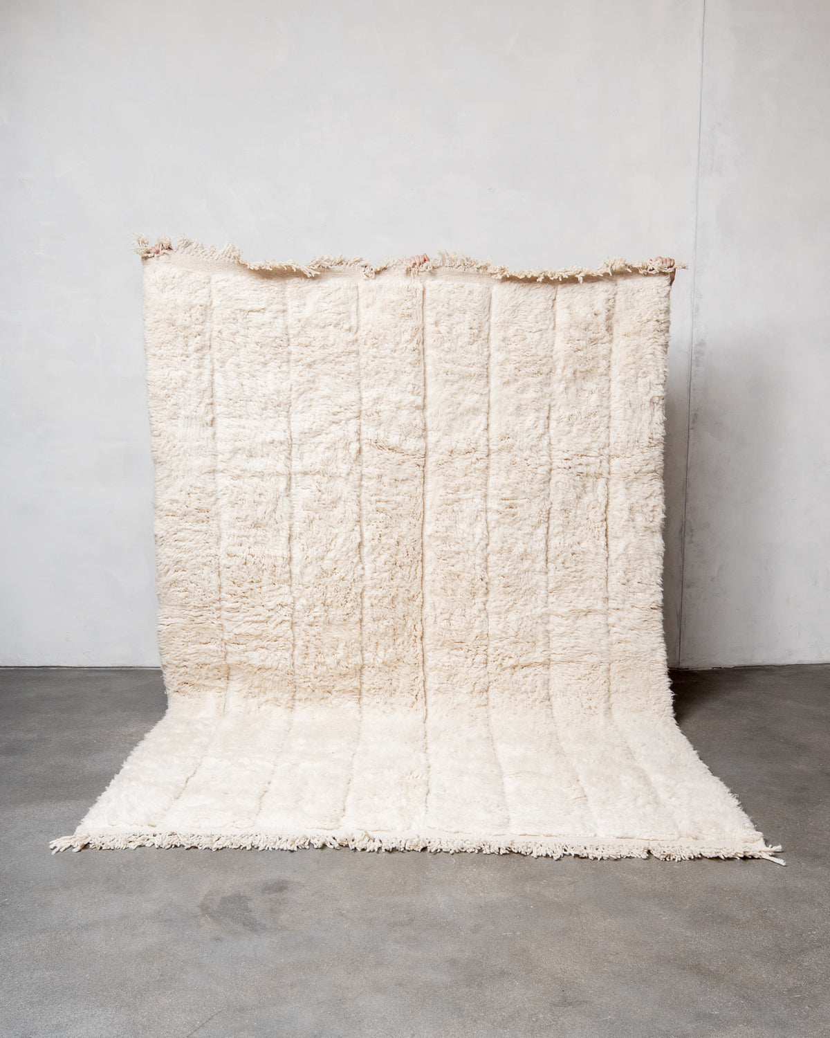 Modern, designer, handcrafted Berber rug from Morocco. Beniourain carpet with minimalist design, natural wool pile and a fluffy texture.