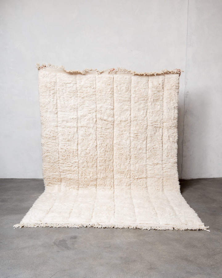 Modern, designer, handcrafted Berber rug from Morocco. Beniourain carpet with minimalist design, natural wool pile and a fluffy texture.