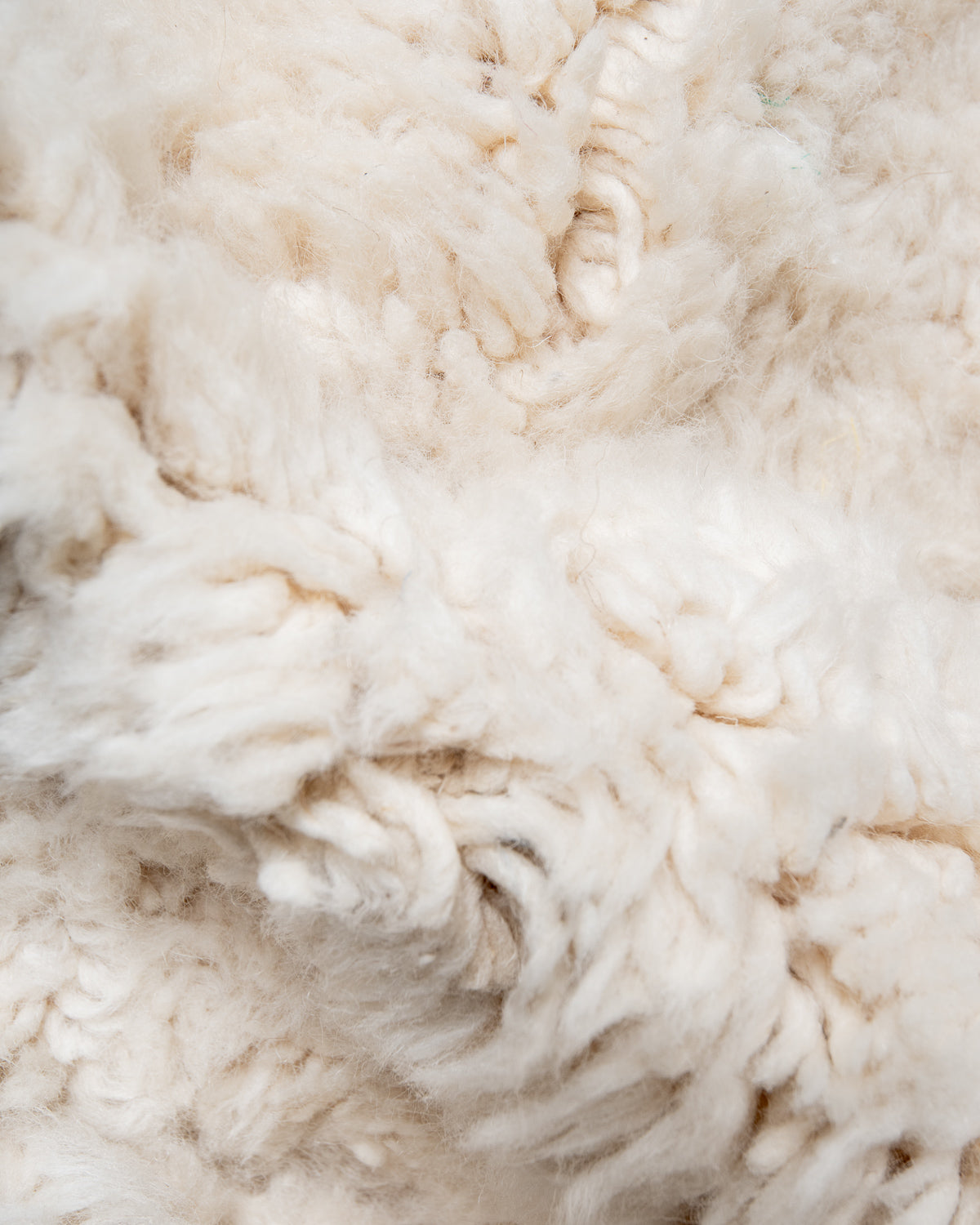 Modern, designer, handcrafted Berber rug from Morocco. Beniourain carpet with minimalist design, natural wool pile and a fluffy texture.