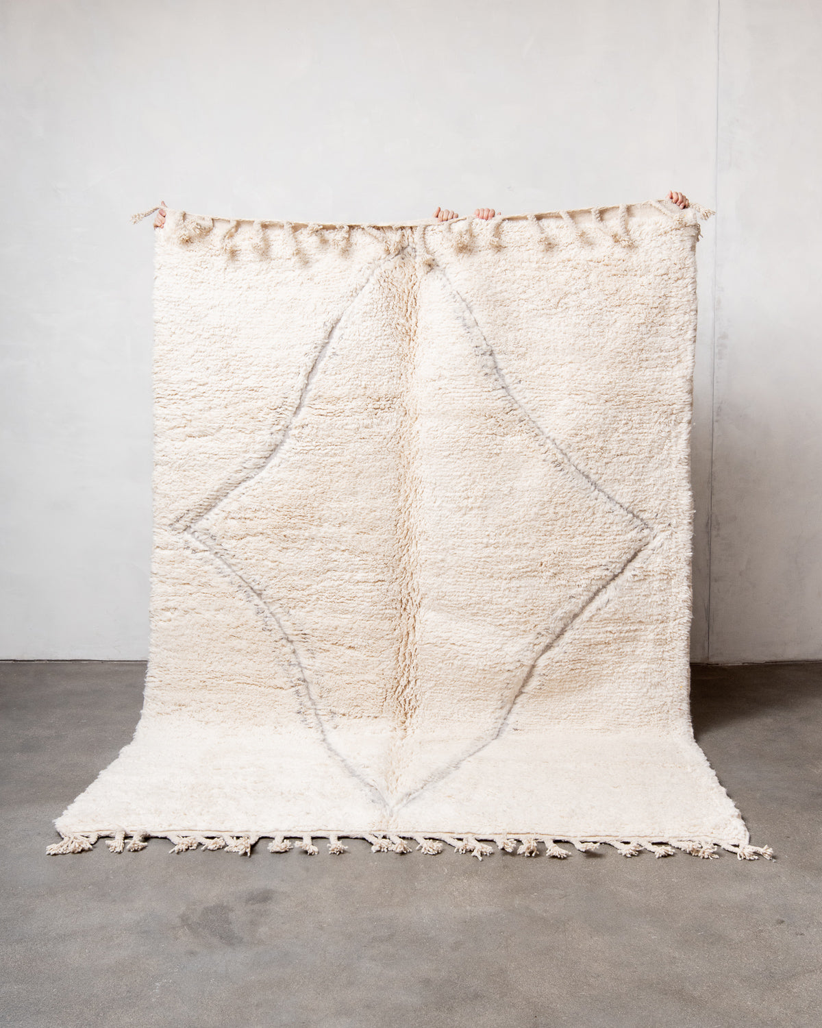 Modern, designer, handcrafted Berber rug from Morocco. Beniourain carpet with minimalist design, natural wool pile and a fluffy texture.