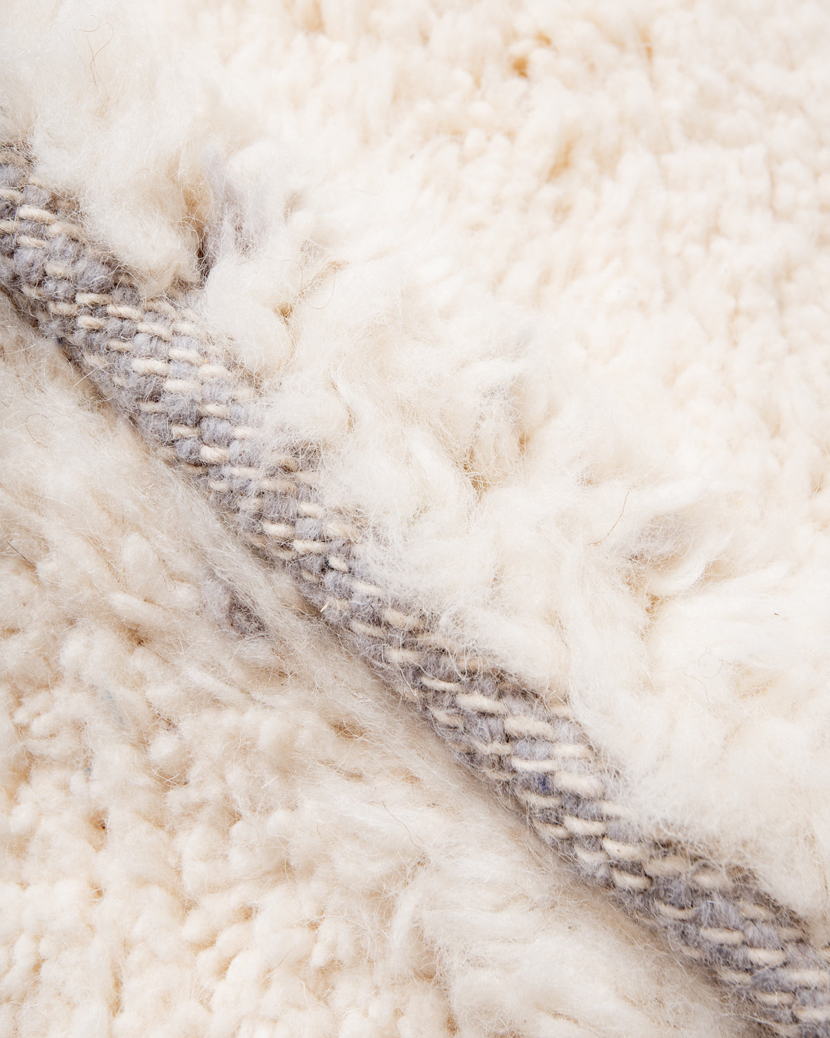 Modern, designer, handcrafted Berber rug from Morocco. Beniourain carpet with minimalist design, natural wool pile and a fluffy texture.