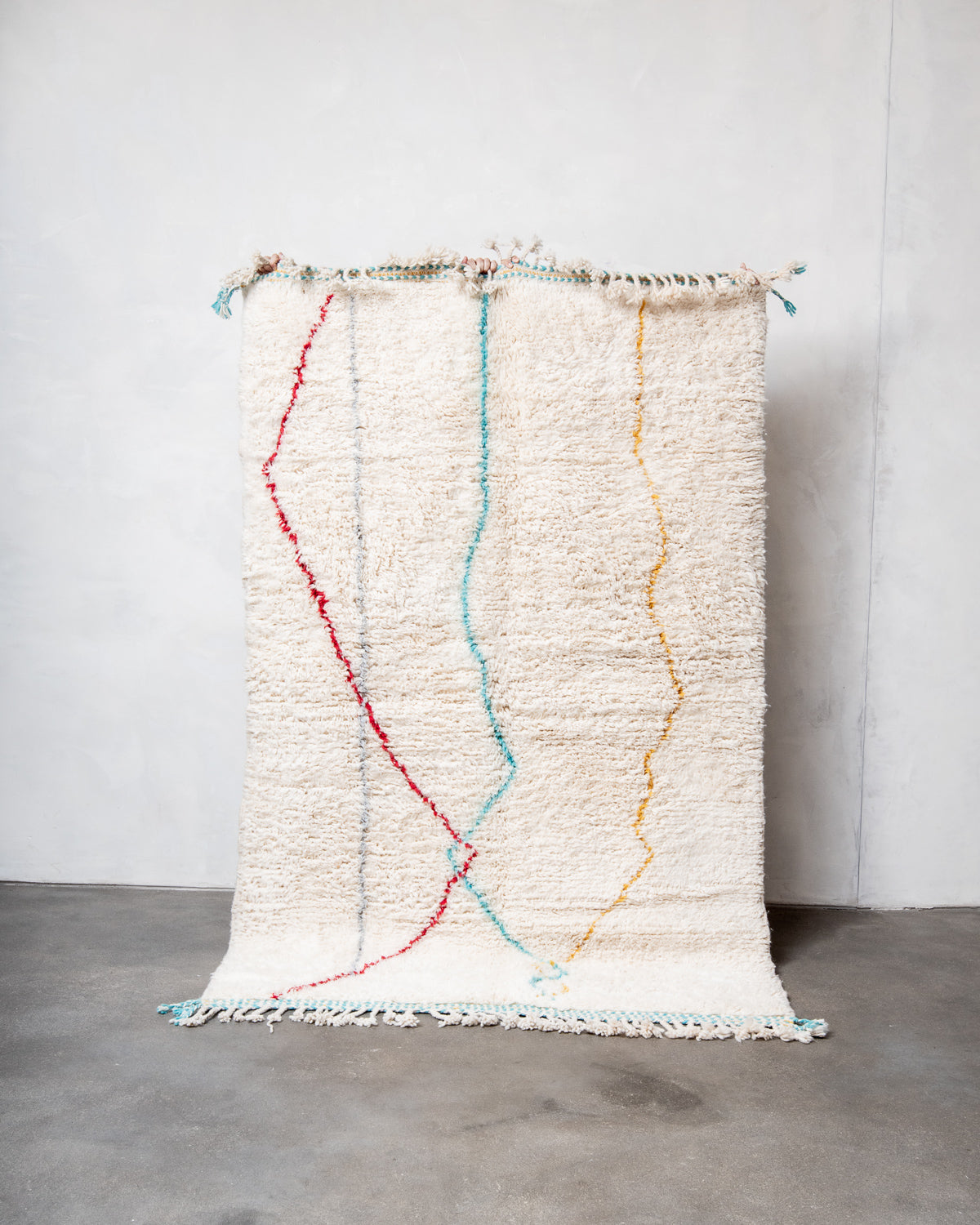 Modern, designer, handcrafted Berber rug from Morocco. Beniourain carpet with minimalist design, natural wool pile and a fluffy texture.