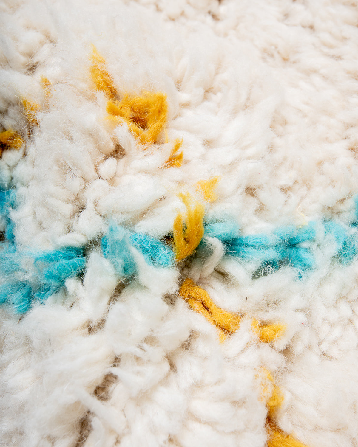 Modern, designer, handcrafted Berber rug from Morocco. Beniourain carpet with minimalist design, natural wool pile and a fluffy texture.