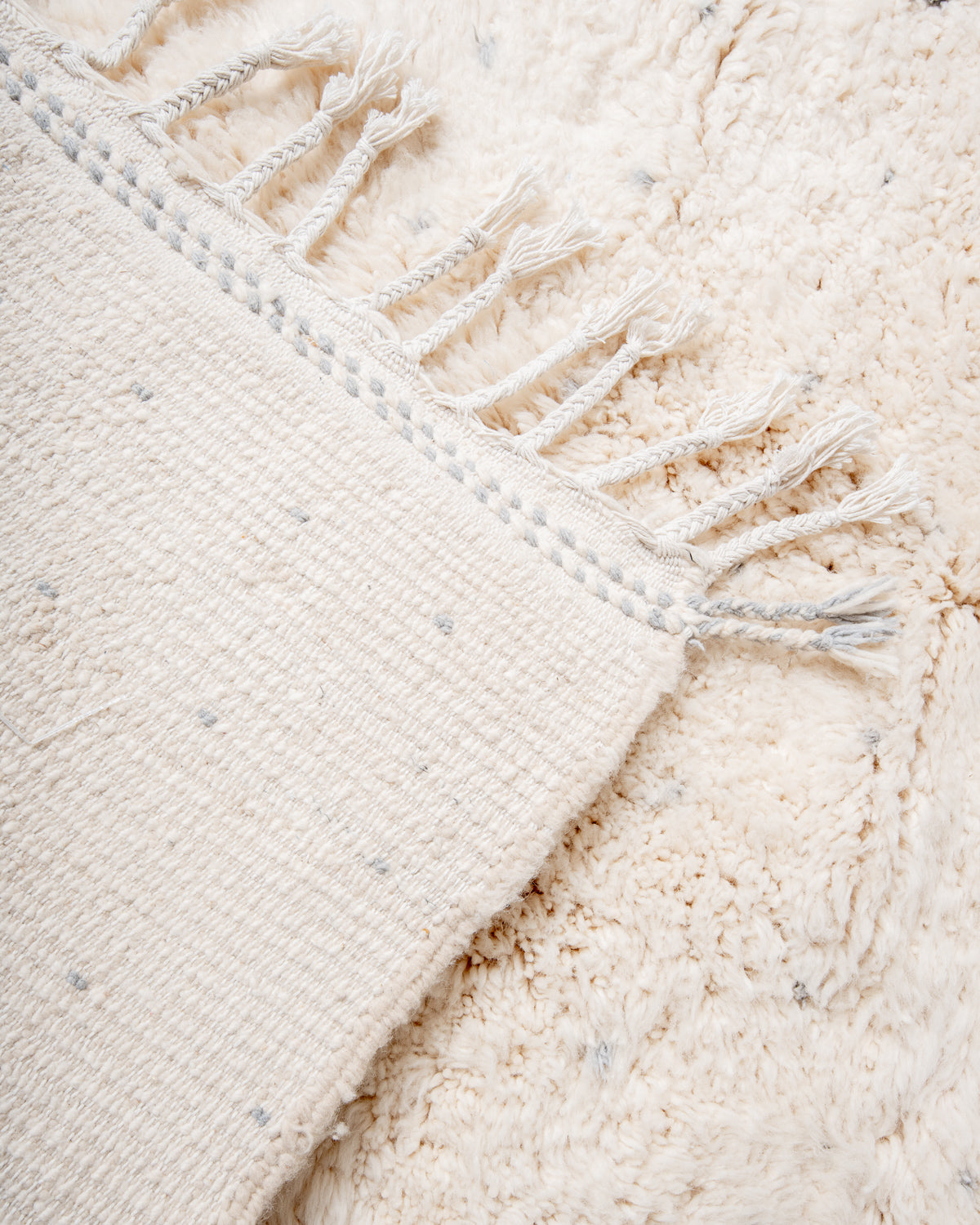 Modern, designer, handcrafted Berber rug from Morocco. Beniourain carpet with minimalist design, natural wool pile and a fluffy texture.