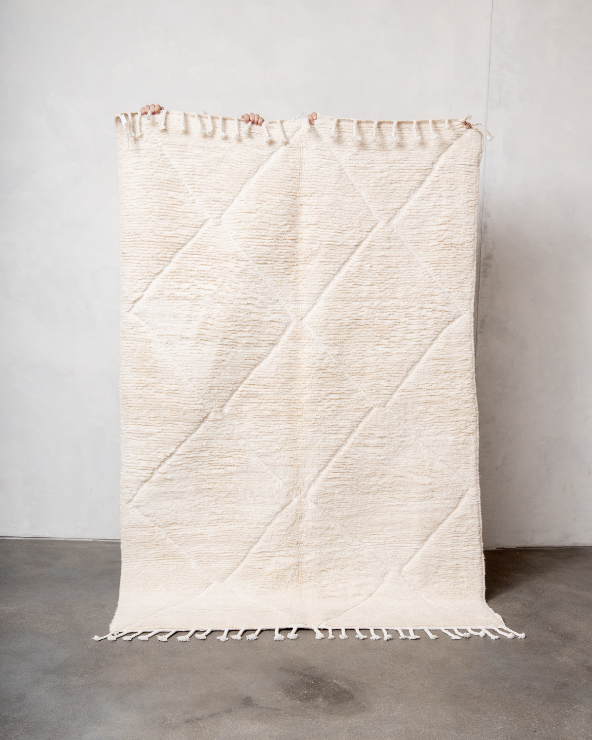 Modern, designer, handcrafted Berber rug from Morocco. Beniourain carpet with minimalist design, natural wool pile and a fluffy texture.