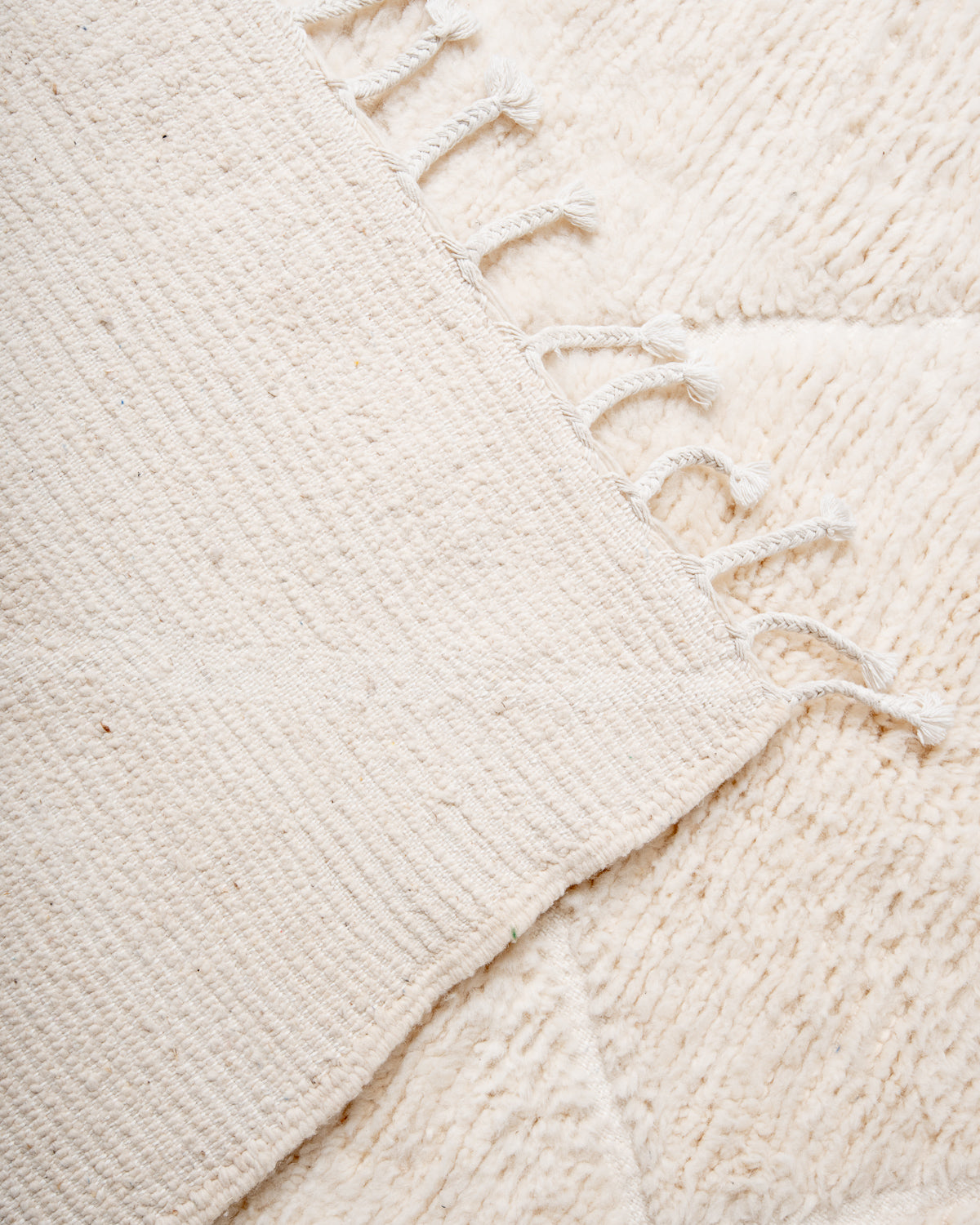 Modern, designer, handcrafted Berber rug from Morocco. Beniourain carpet with minimalist design, natural wool pile and a fluffy texture.