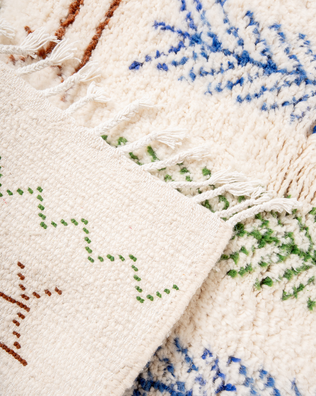 Modern, designer, handcrafted Berber rug from Morocco. Beniourain carpet with minimalist design, natural wool pile and a fluffy texture.