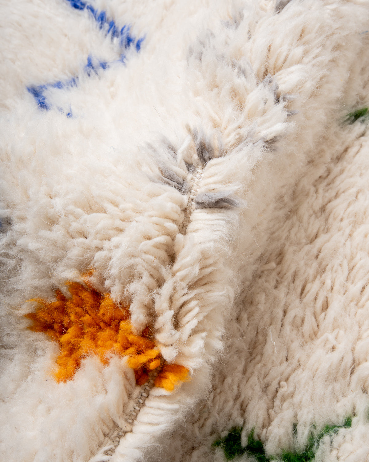 Modern, designer, handcrafted Berber rug from Morocco. Beniourain carpet with minimalist design, natural wool pile and a fluffy texture.