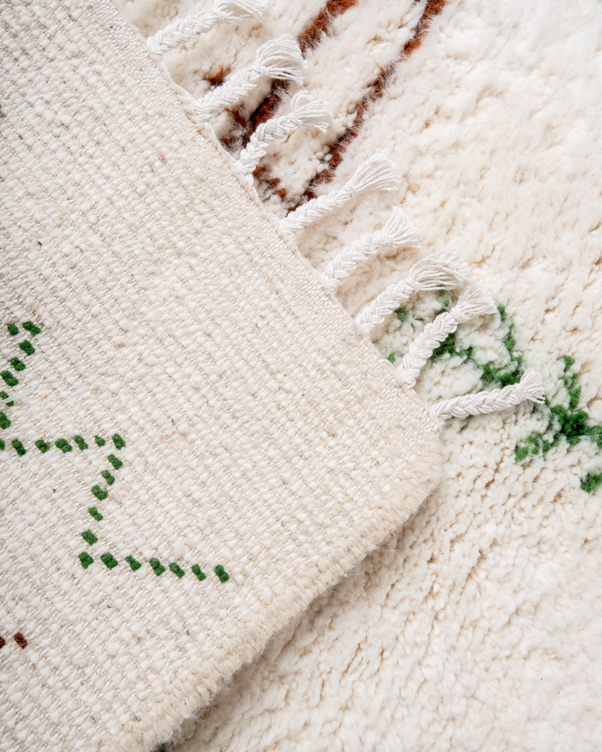 Modern, designer, handcrafted Berber rug from Morocco. Beniourain carpet with minimalist design, natural wool pile and a fluffy texture.