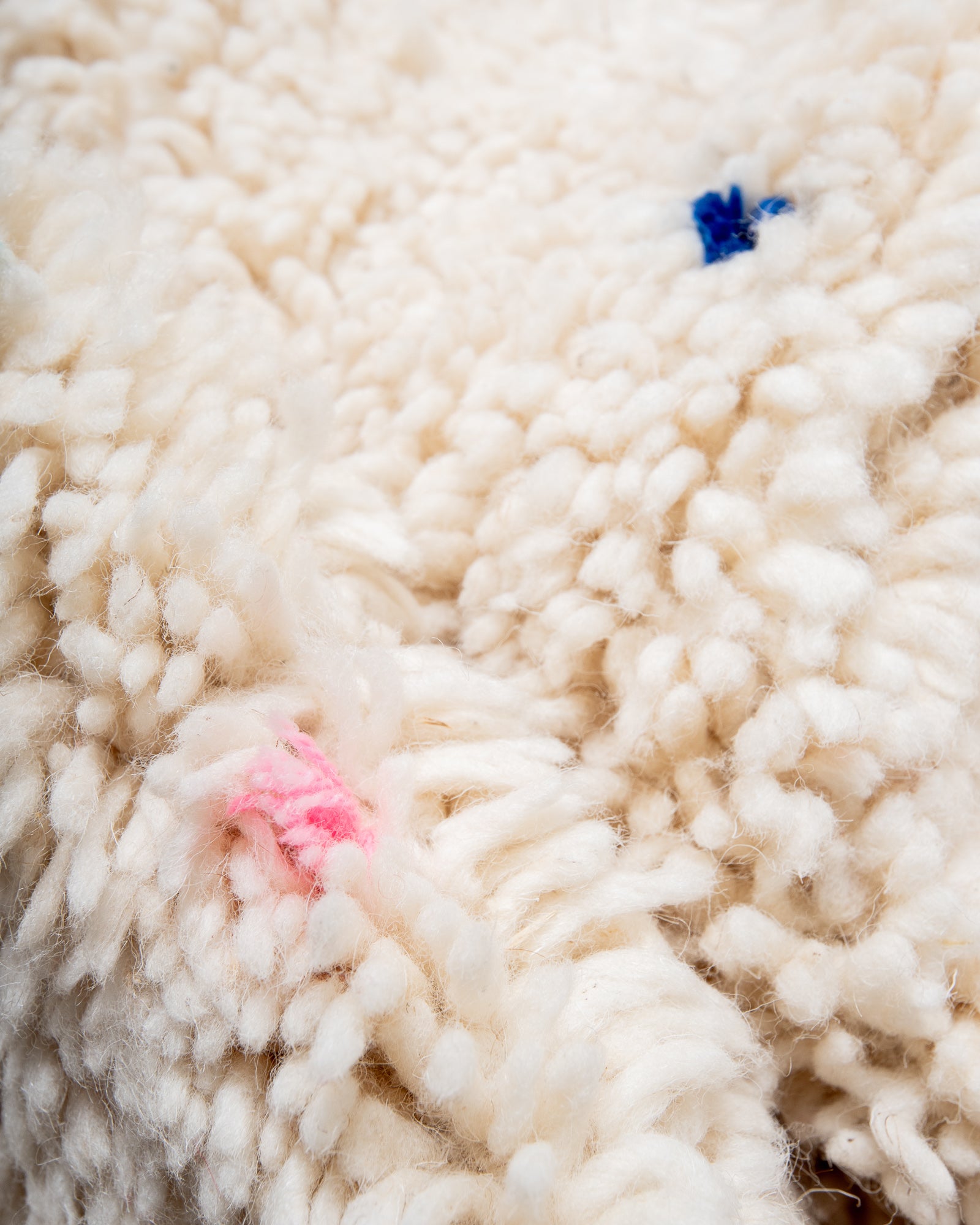 Modern, designer, handcrafted Berber rug from Morocco. Beniourain carpet with minimalist design, natural wool pile and a fluffy texture.