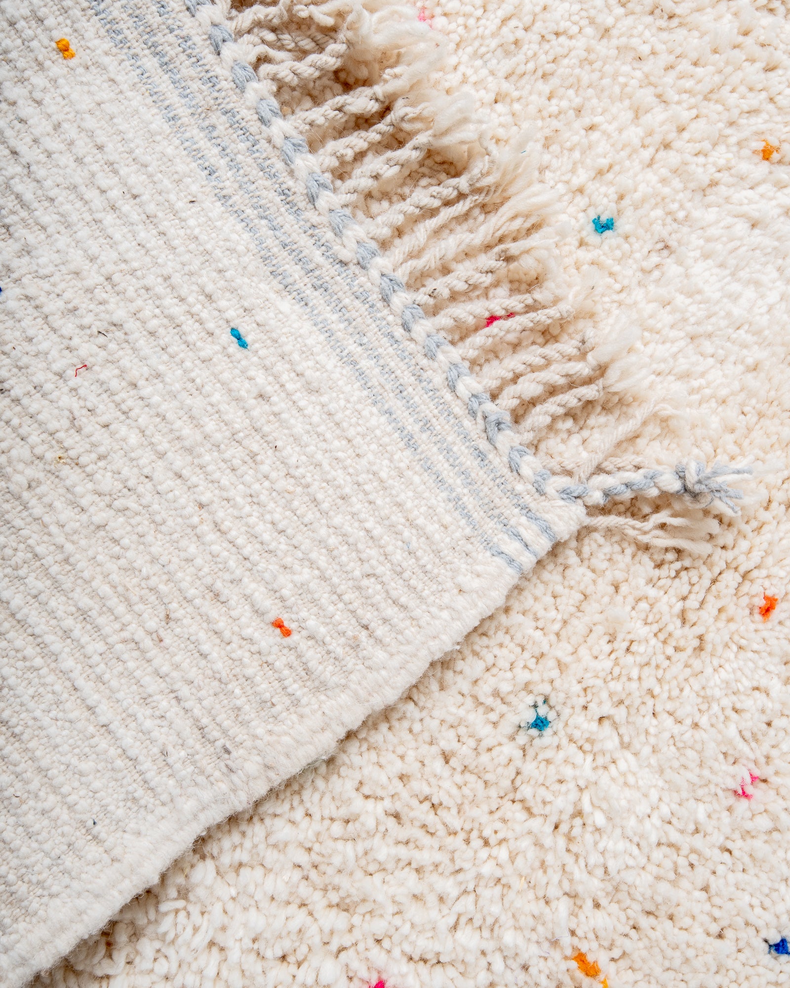 Modern, designer, handcrafted Berber rug from Morocco. Beniourain carpet with minimalist design, natural wool pile and a fluffy texture.