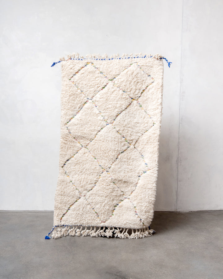 Modern, designer, handcrafted Berber rug from Morocco. Beniourain carpet with minimalist design, natural wool pile and a fluffy texture.