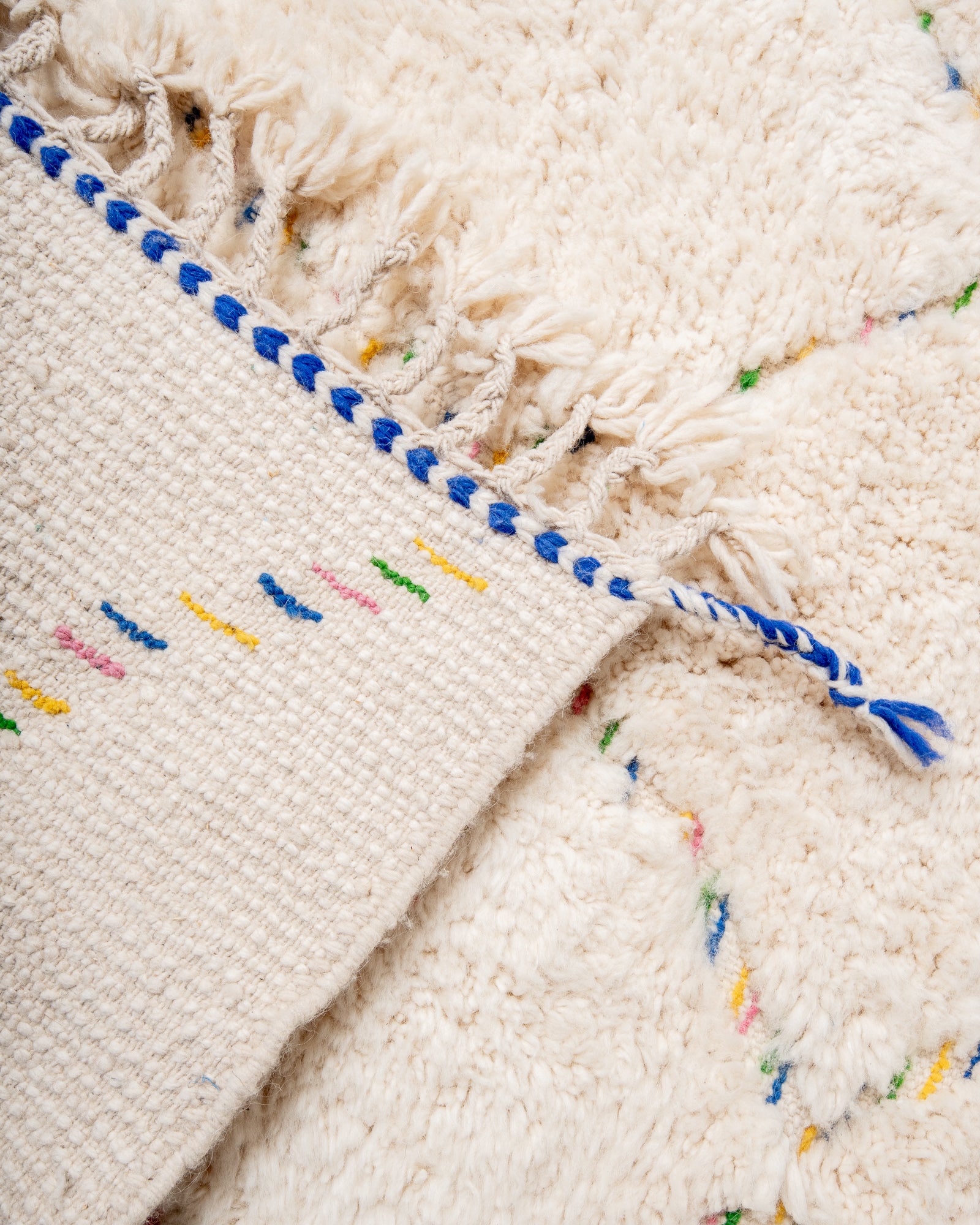 Modern, designer, handcrafted Berber rug from Morocco. Beniourain carpet with minimalist design, natural wool pile and a fluffy texture.