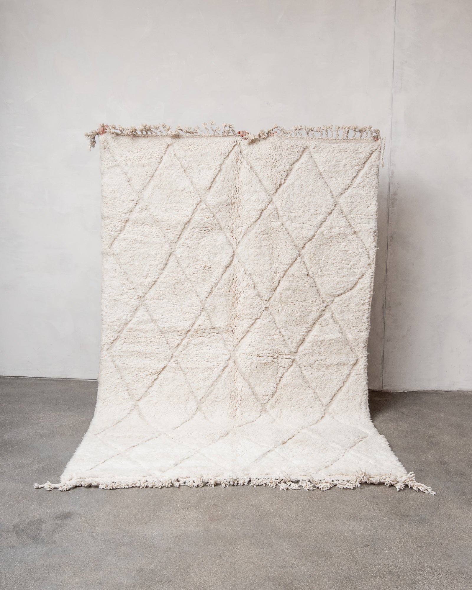 Modern, designer, handcrafted Berber rug from Morocco. Beniourain carpet with minimalist design, natural wool pile and a fluffy texture.