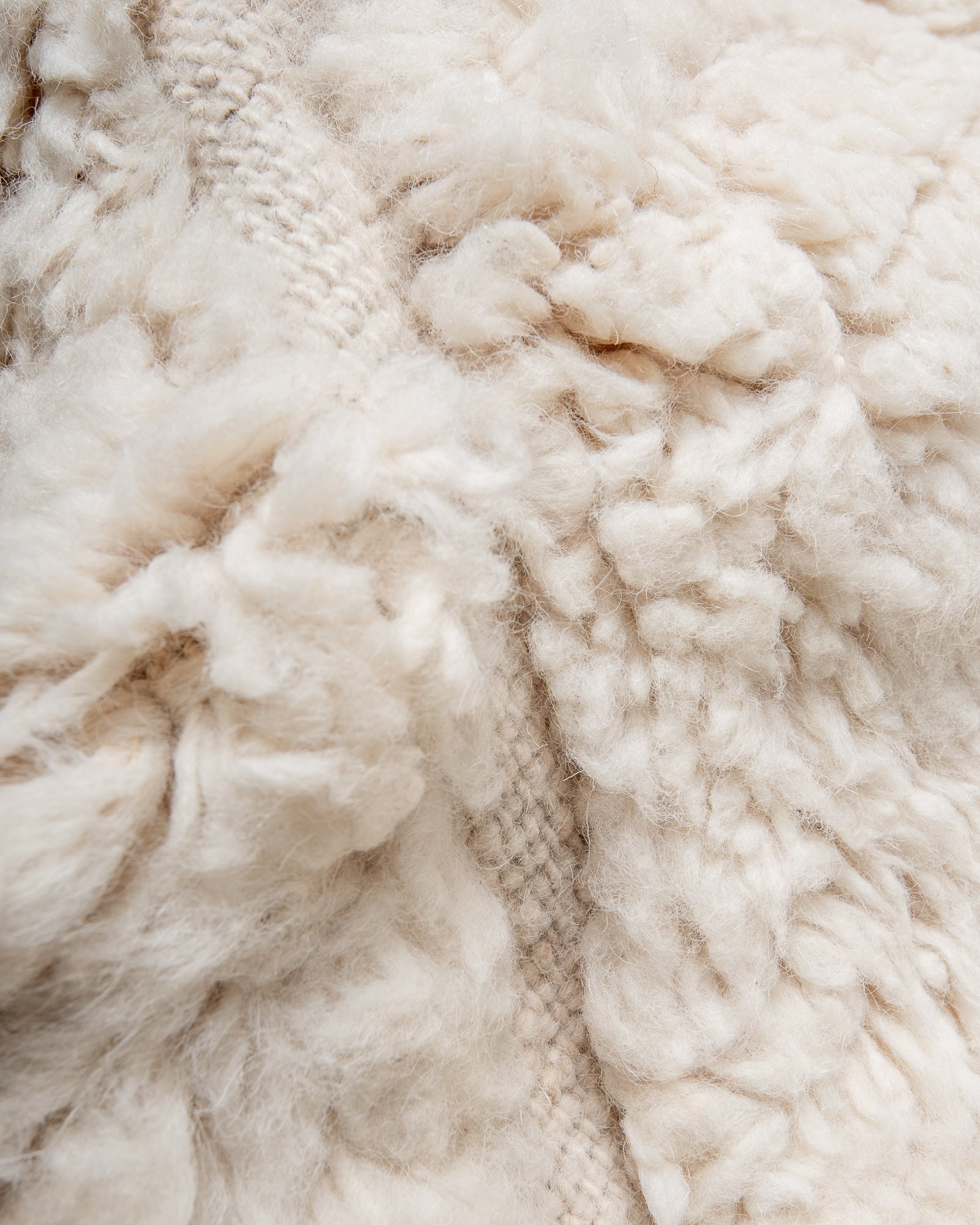 Modern, designer, handcrafted Berber rug from Morocco. Beniourain carpet with minimalist design, natural wool pile and a fluffy texture.