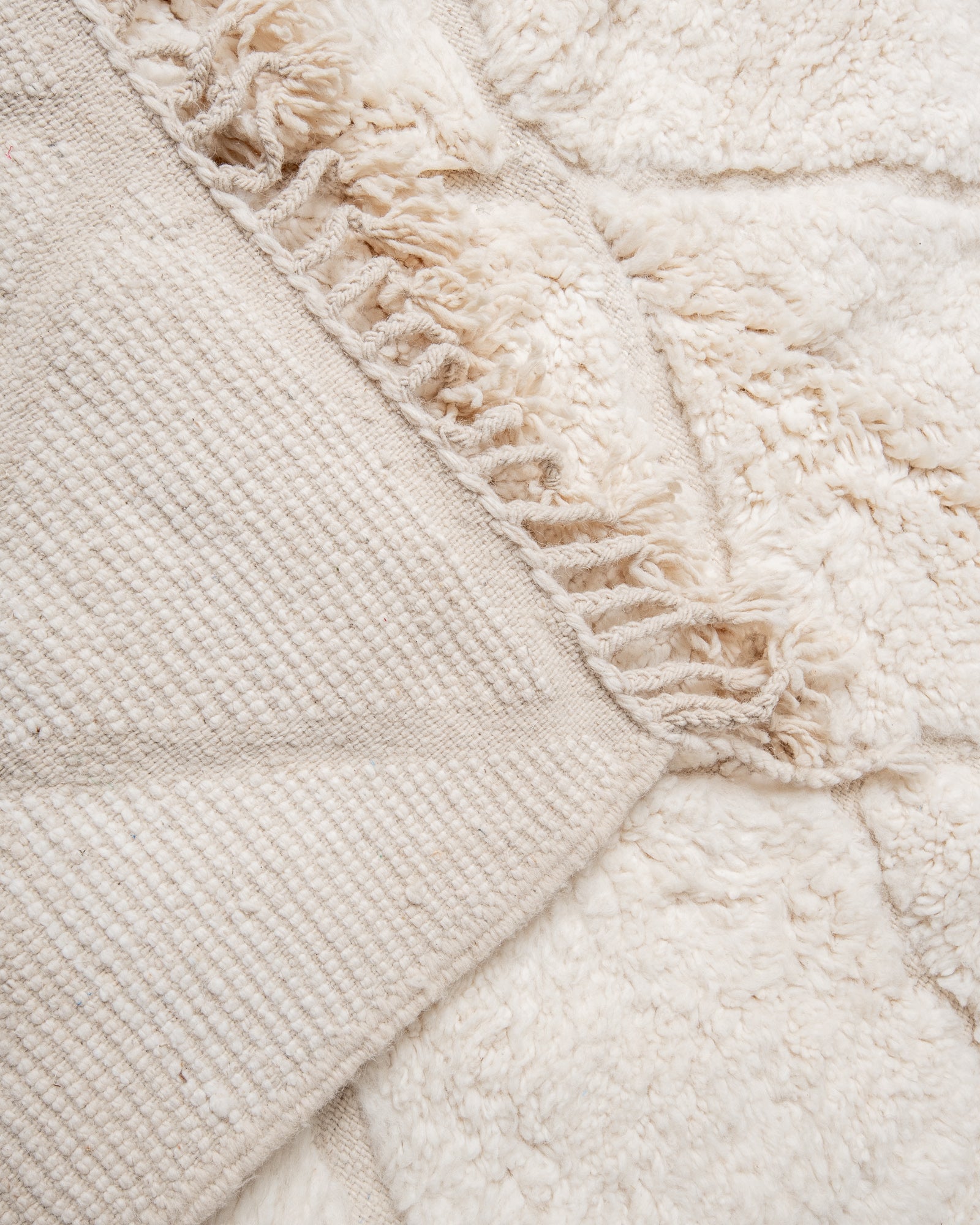 Modern, designer, handcrafted Berber rug from Morocco. Beniourain carpet with minimalist design, natural wool pile and a fluffy texture.