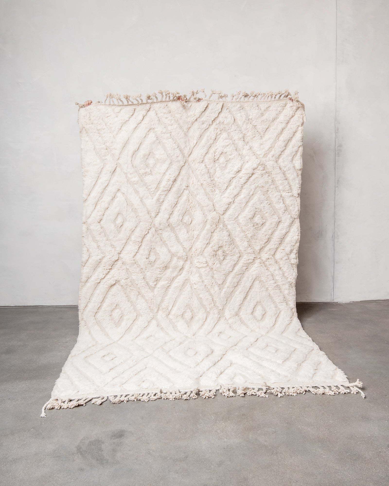 Modern, designer, handcrafted Berber rug from Morocco. Beniourain carpet with minimalist design, natural wool pile and a fluffy texture.