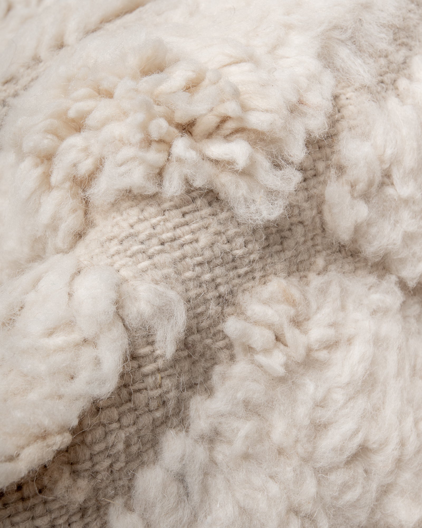 Modern, designer, handcrafted Berber rug from Morocco. Beniourain carpet with minimalist design, natural wool pile and a fluffy texture.