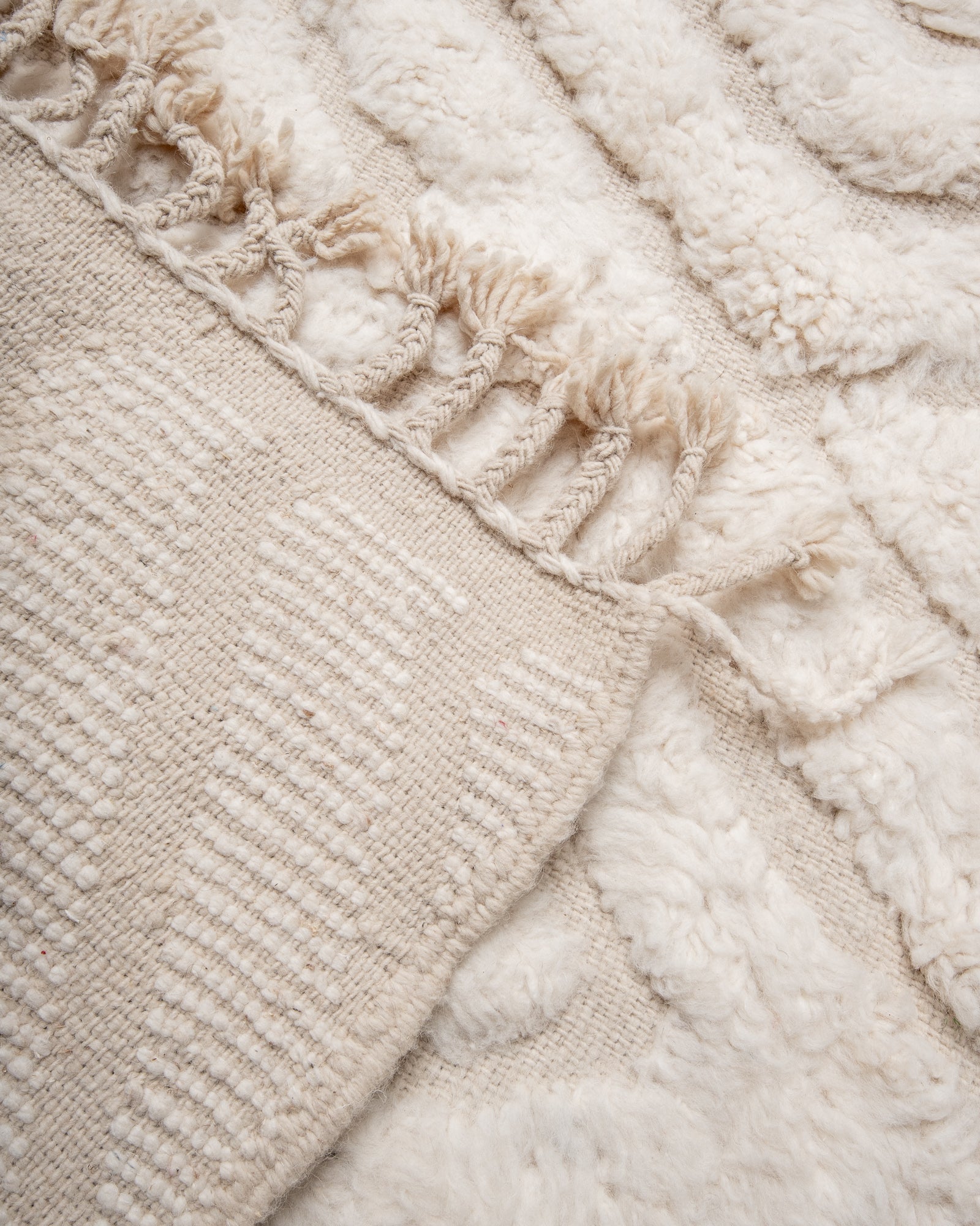 Modern, designer, handcrafted Berber rug from Morocco. Beniourain carpet with minimalist design, natural wool pile and a fluffy texture.