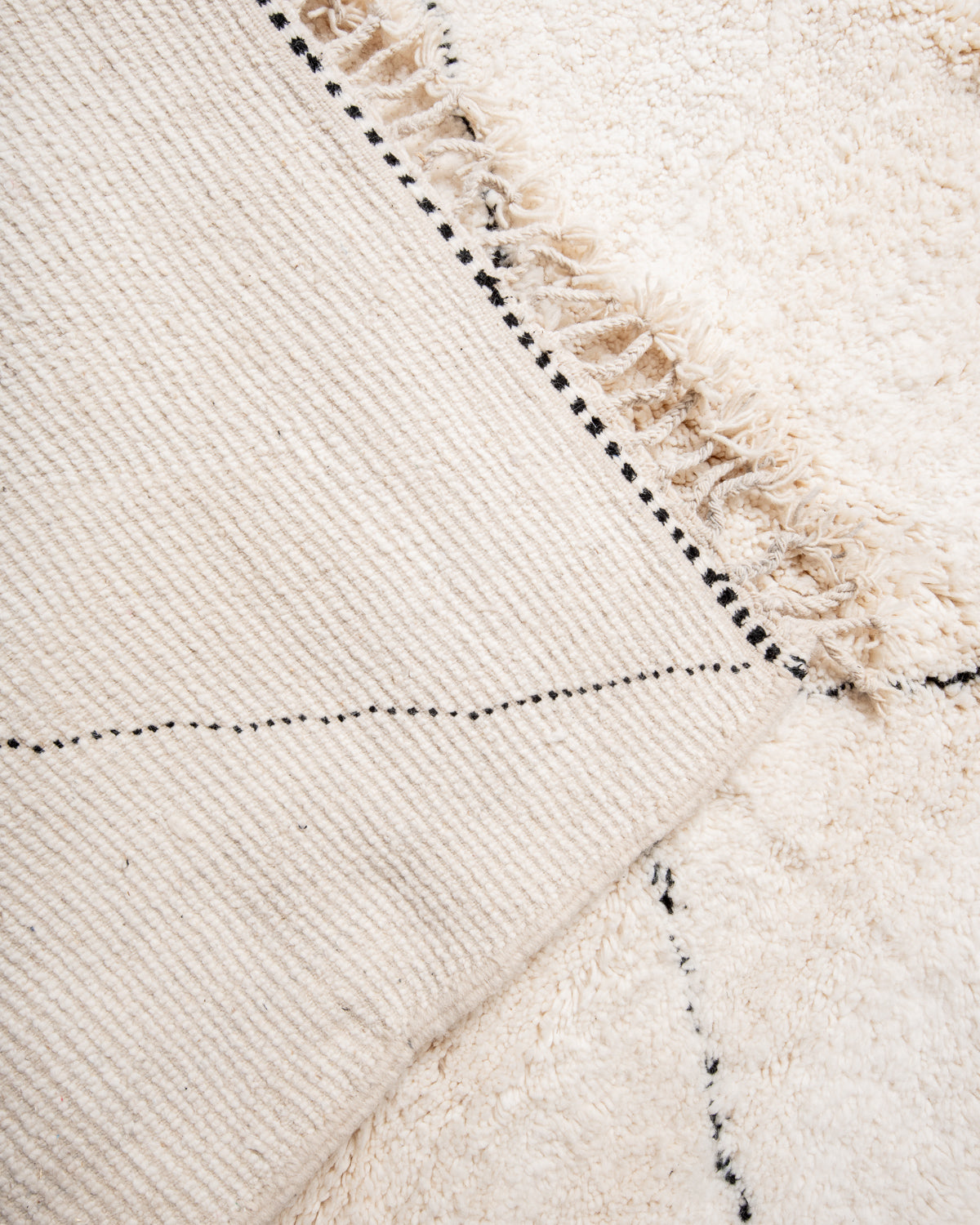 Modern, designer, handcrafted Berber rug from Morocco. Beniourain carpet with beautiful colours and patterns and fluffy wool texture.