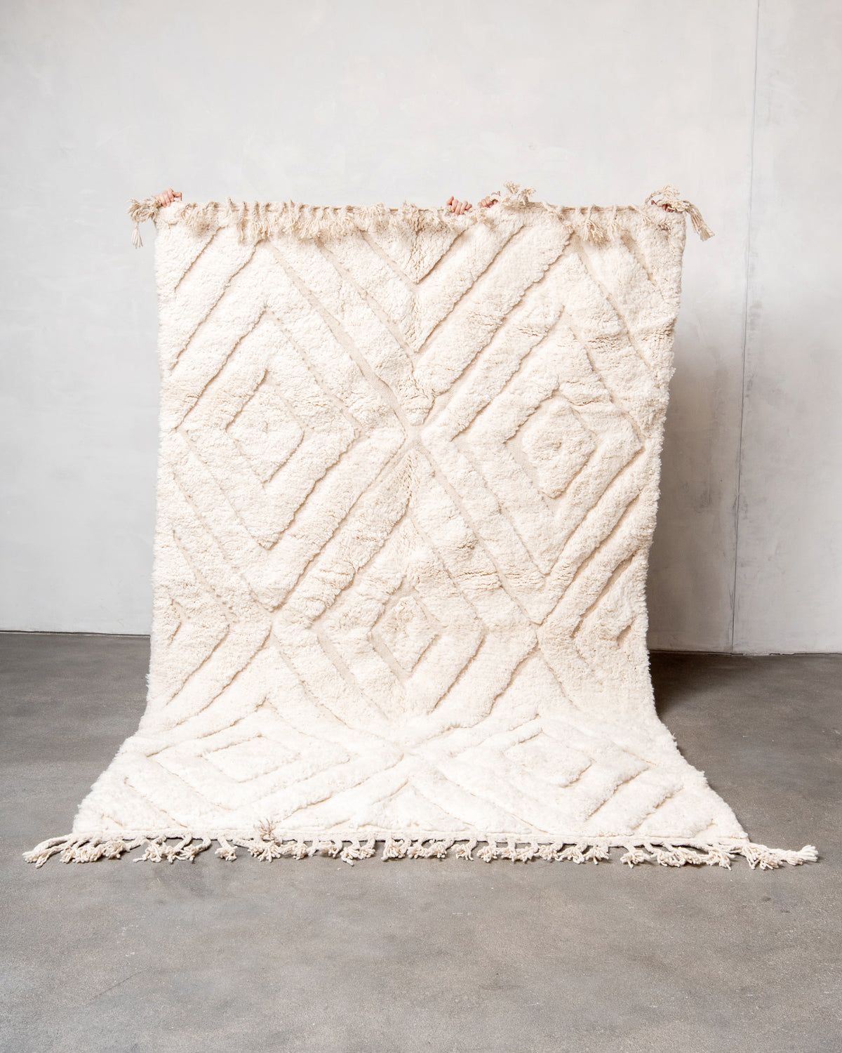 Modern, designer, handcrafted Berber rug from Morocco. Beniourain carpet with beautiful colours and patterns and fluffy wool texture.