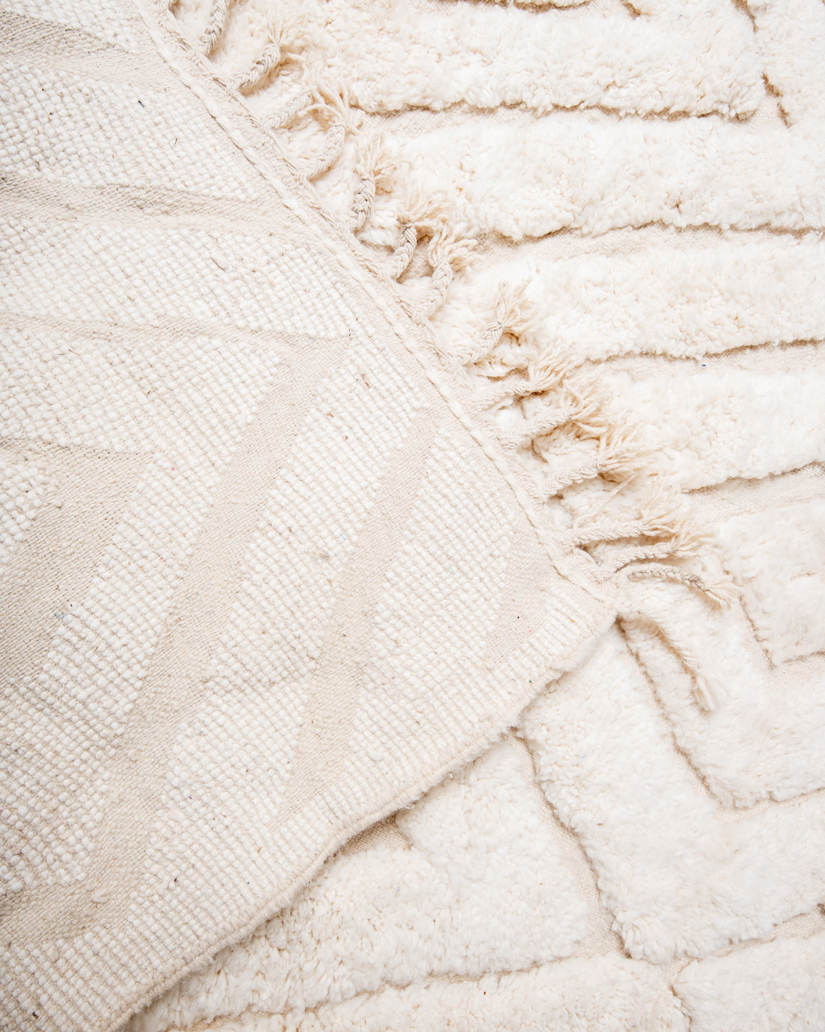 Modern, designer, handcrafted Berber rug from Morocco. Beniourain carpet with beautiful colours and patterns and fluffy wool texture.