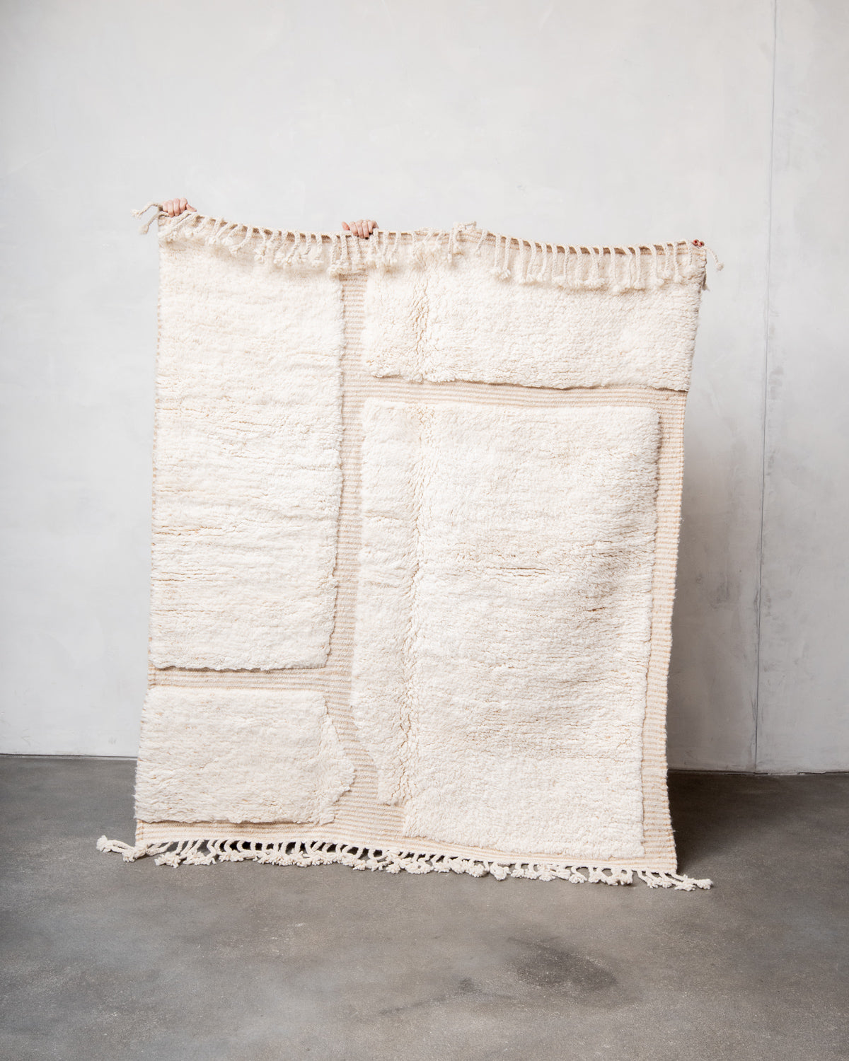 Modern, designer, handcrafted Berber rug from Morocco. Beniourain carpet with beautiful colours and patterns and fluffy wool texture.