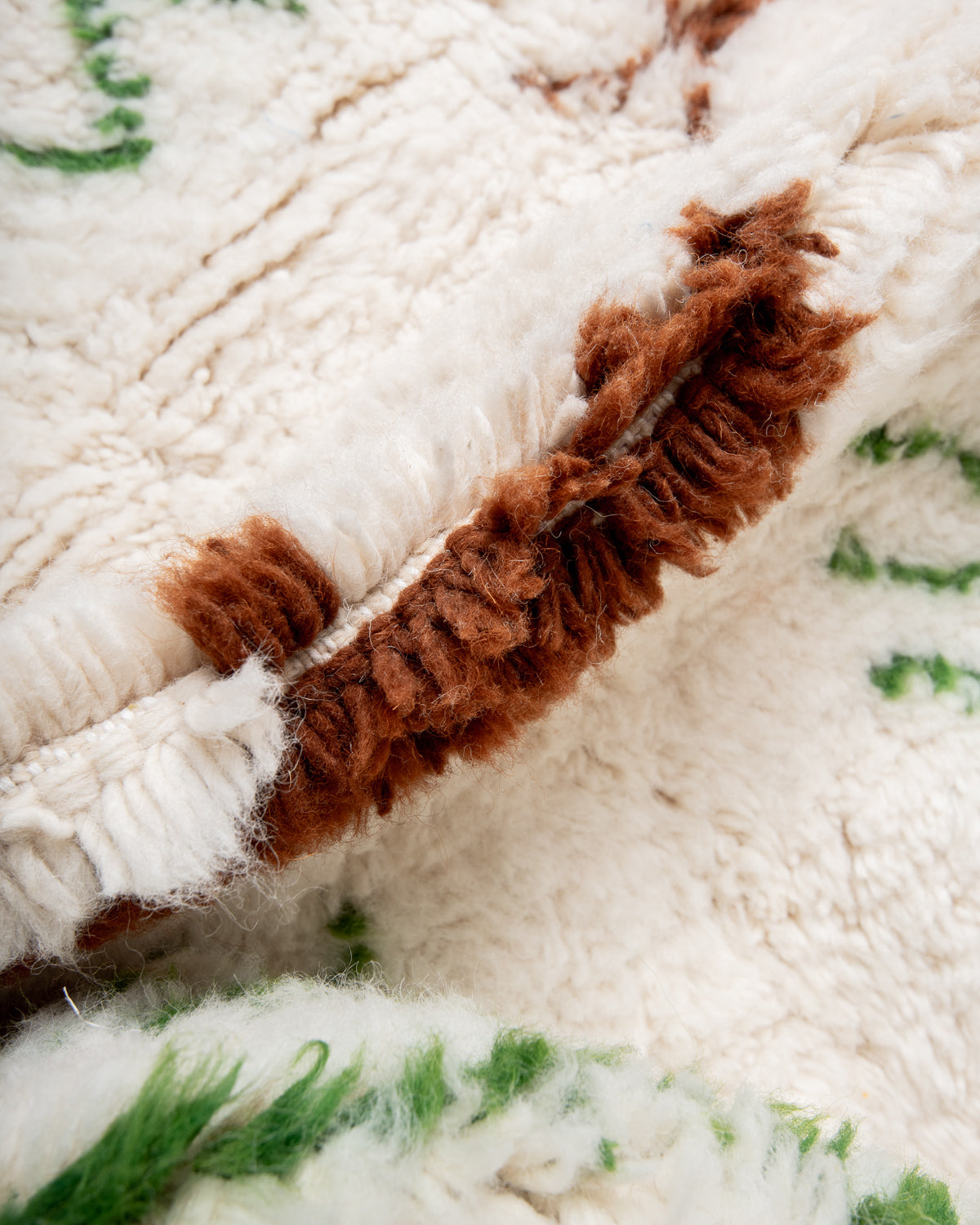 Modern, designer, handcrafted Berber rug from Morocco. Beniourain carpet with beautiful colours and patterns and fluffy wool texture.