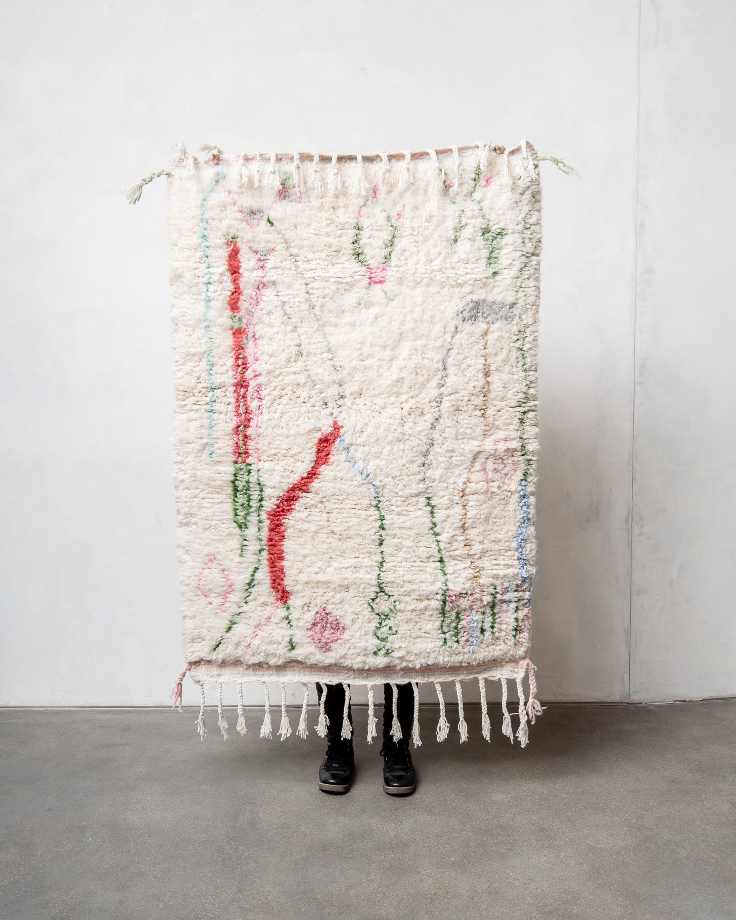 Modern, designer, handcrafted Berber rug from Morocco. Beniourain carpet with beautiful colours and patterns and fluffy wool texture.