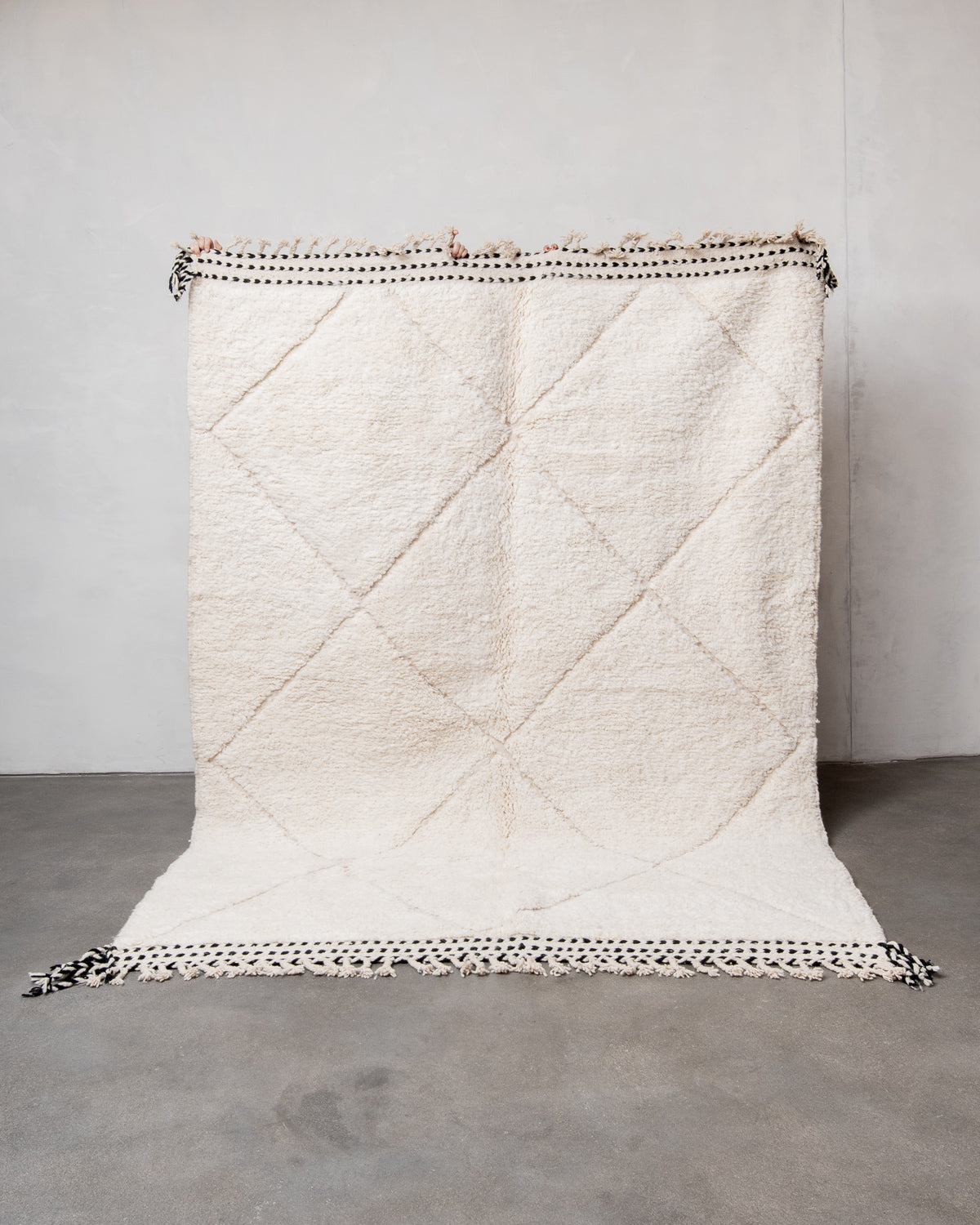 Modern, designer, handcrafted Berber rug from Morocco. Beniourain carpet with minimalist design, natural wool pile and a fluffy texture.