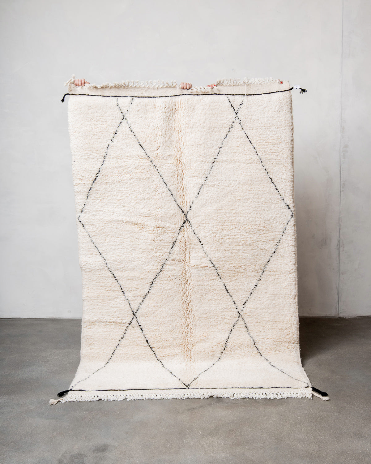 Modern, designer, handcrafted Berber rug from Morocco. Beniourain carpet with minimalist design, natural wool pile and a fluffy texture.