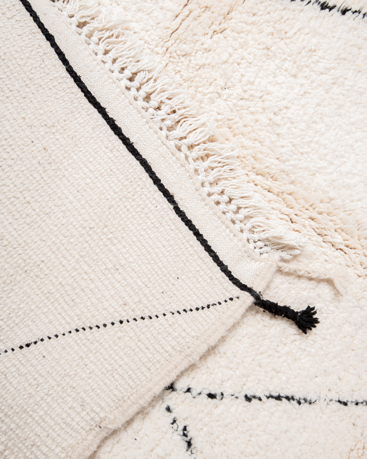 Modern, designer, handcrafted Berber rug from Morocco. Beniourain carpet with minimalist design, natural wool pile and a fluffy texture.