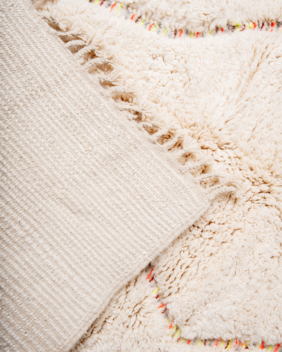 Modern, designer, handcrafted Berber rug from Morocco. Beniourain carpet with beautiful colours and patterns and fluffy wool texture.