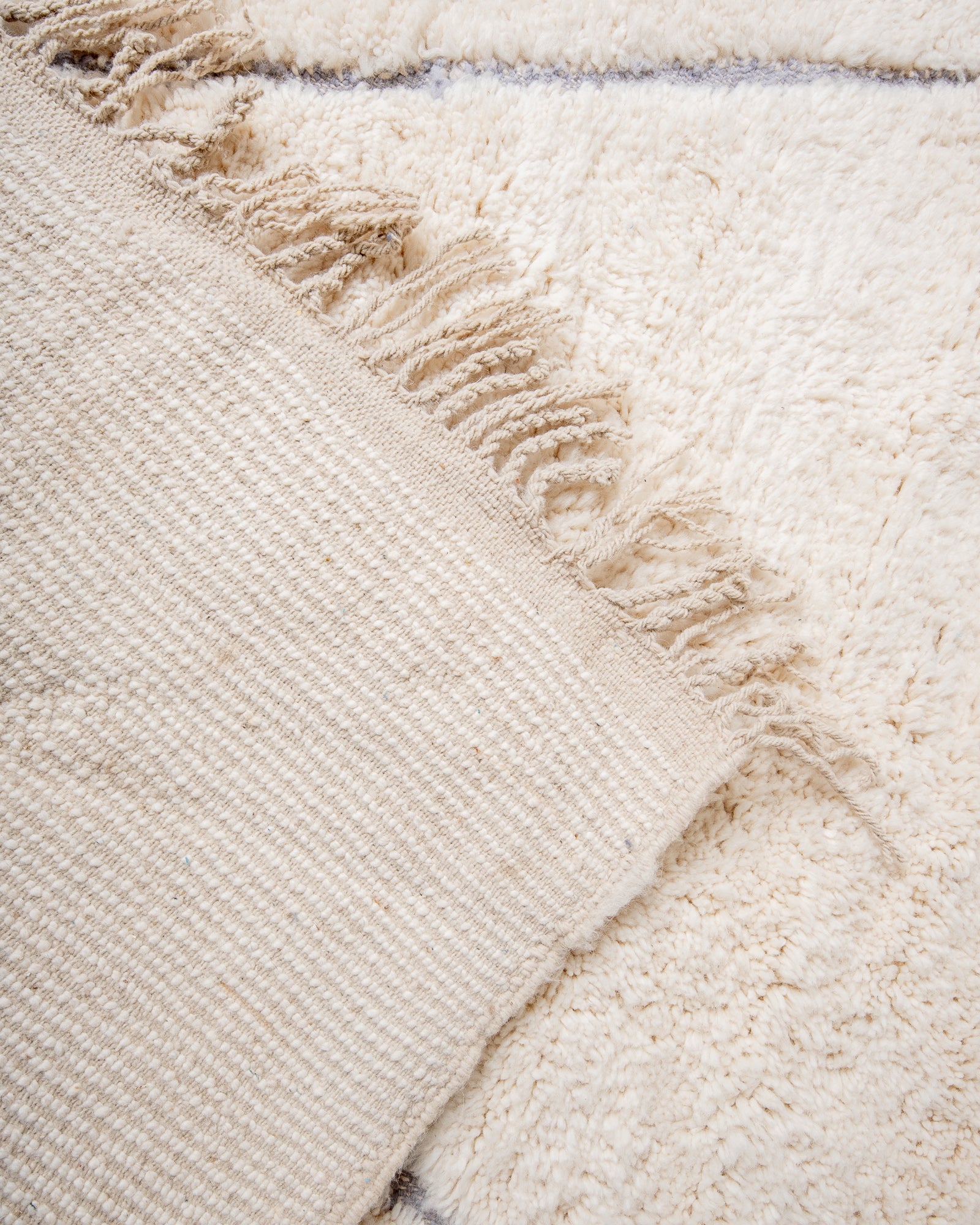 Modern, designer, handcrafted Berber rug from Morocco. Beniourain carpet with beautiful colours and patterns and fluffy wool texture.