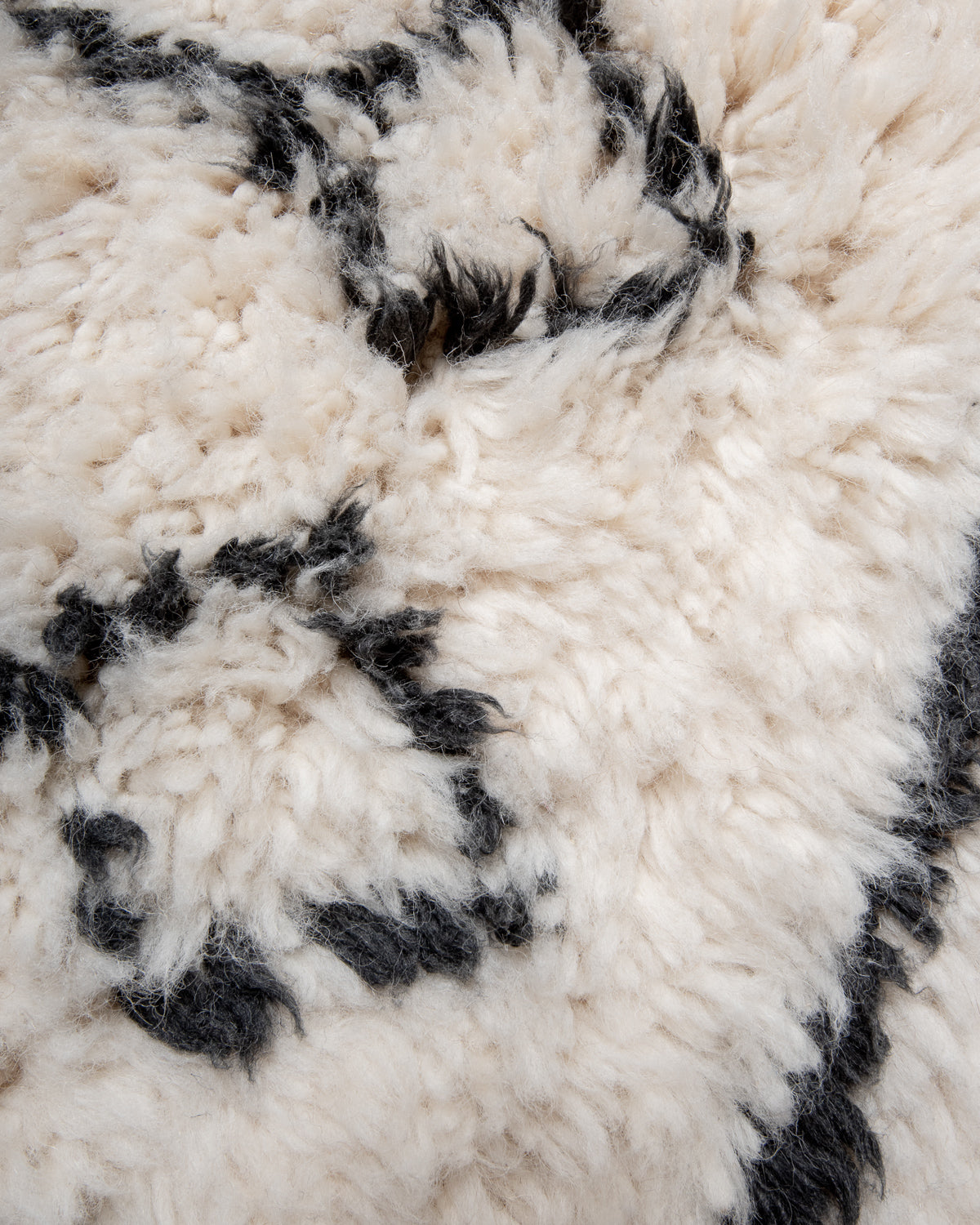 Modern, designer, handcrafted Berber rug from Morocco. Beniourain carpet with beautiful colours and patterns and fluffy wool texture.