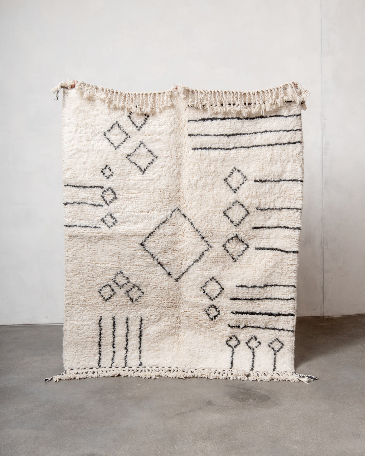 Modern, designer, handcrafted Berber rug from Morocco. Beniourain carpet with beautiful colours and patterns and fluffy wool texture.