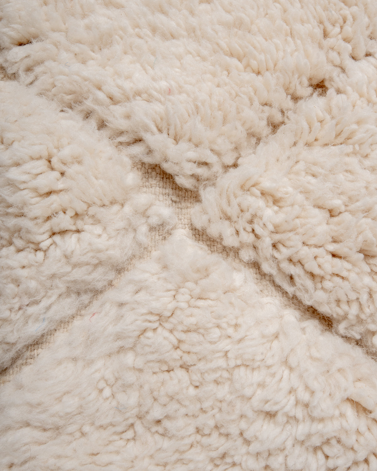 Modern, designer, handcrafted Berber rug from Morocco. Beniourain carpet with minimalist design, natural wool pile and a fluffy texture.