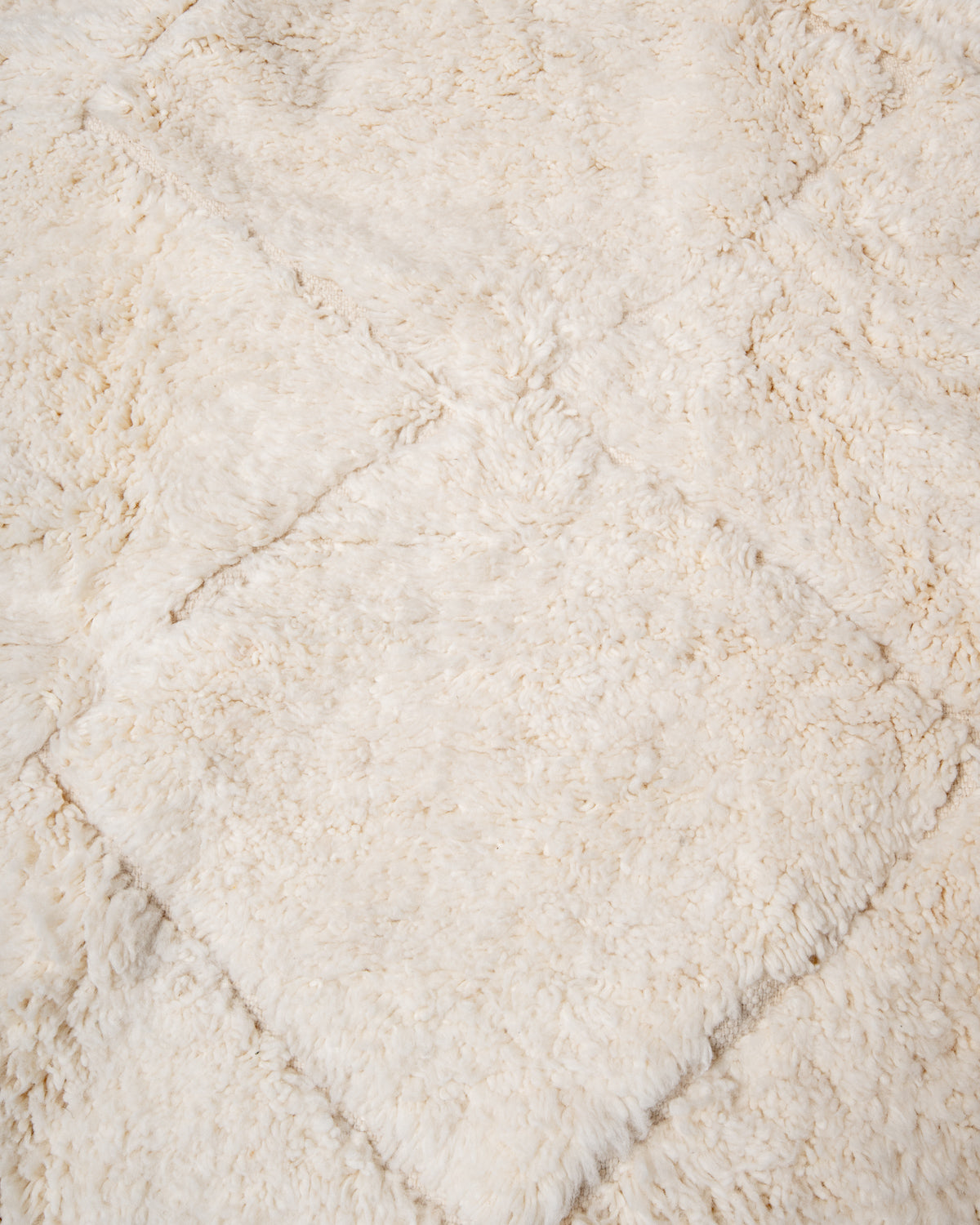 Modern, designer, handcrafted Berber rug from Morocco. Beniourain carpet with minimalist design, natural wool pile and a fluffy texture.