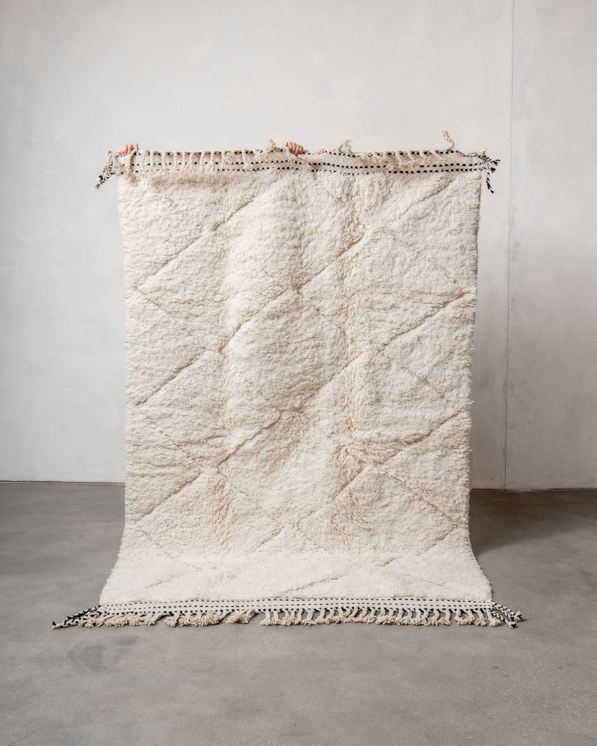 Modern, designer, handcrafted Berber rug from Morocco. Beniourain carpet with minimalist design, natural wool pile and a fluffy texture.