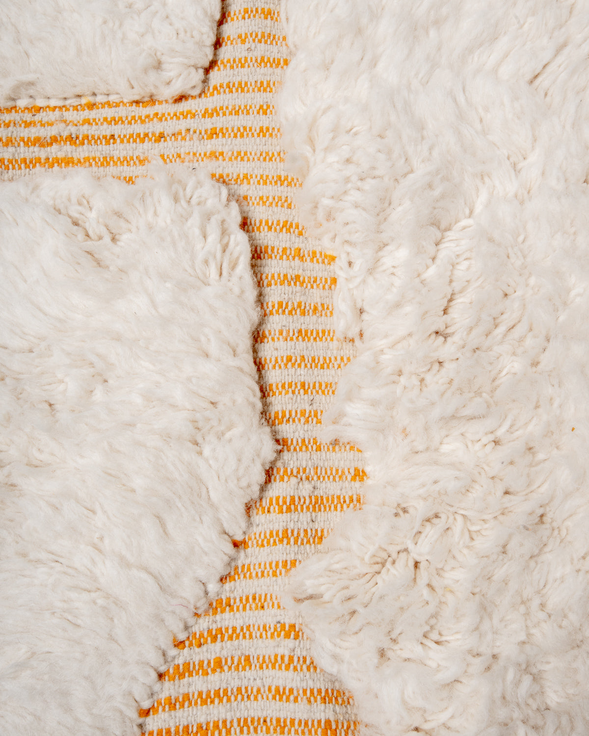 Modern, designer, handcrafted Berber rug from Morocco. Beniourain carpet with beautiful colours and patterns and fluffy wool texture.