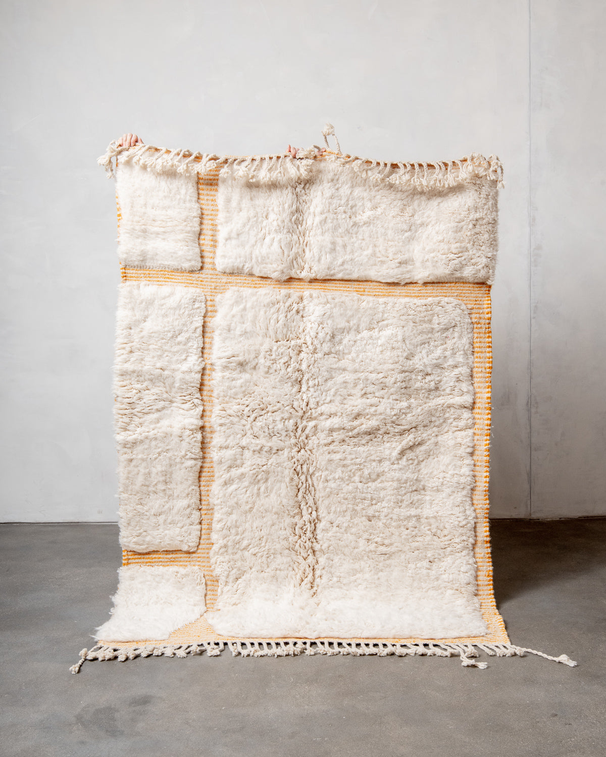 Modern, designer, handcrafted Berber rug from Morocco. Beniourain carpet with beautiful colours and patterns and fluffy wool texture.