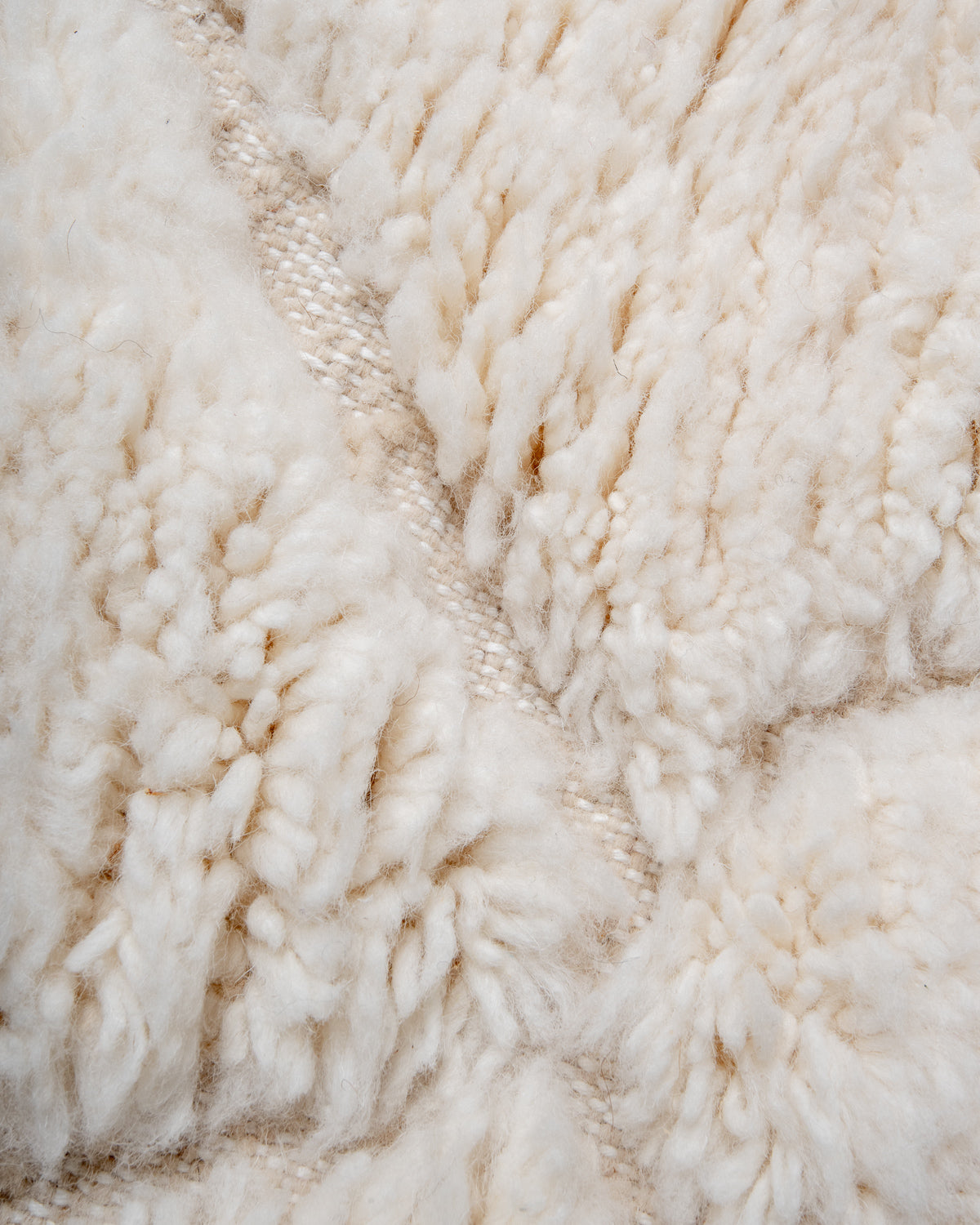 Modern, designer, handcrafted Berber rug from Morocco. Beniourain carpet with minimalist design, natural wool pile and a fluffy texture.